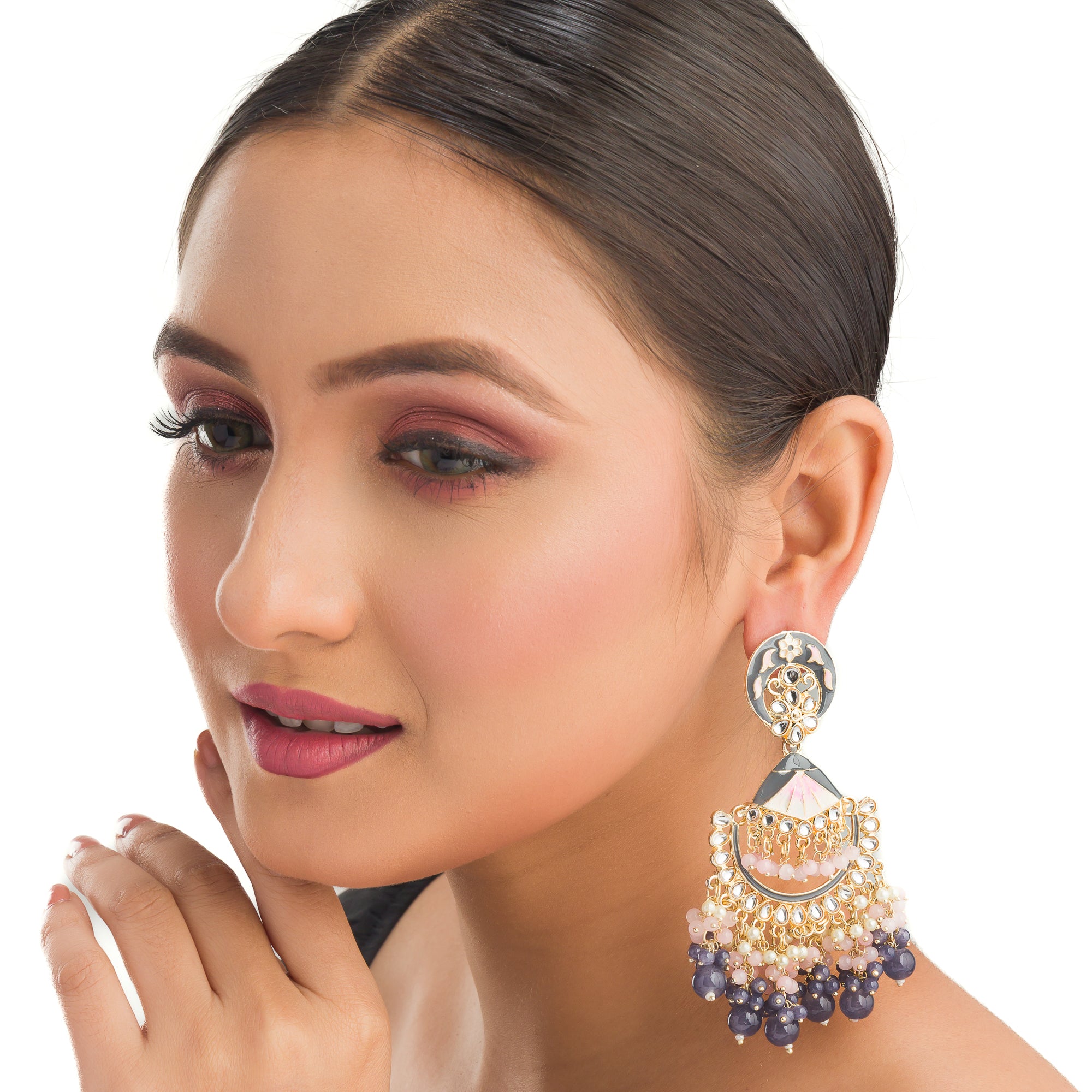 "Pink and white zircon jhumkas blend vibrant color with timeless elegance for a stunning look."