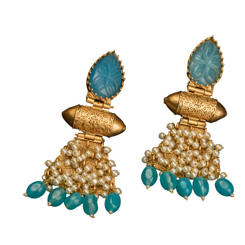 "Blue earrings with gold-tone polish combine vibrant color and a sophisticated finish."