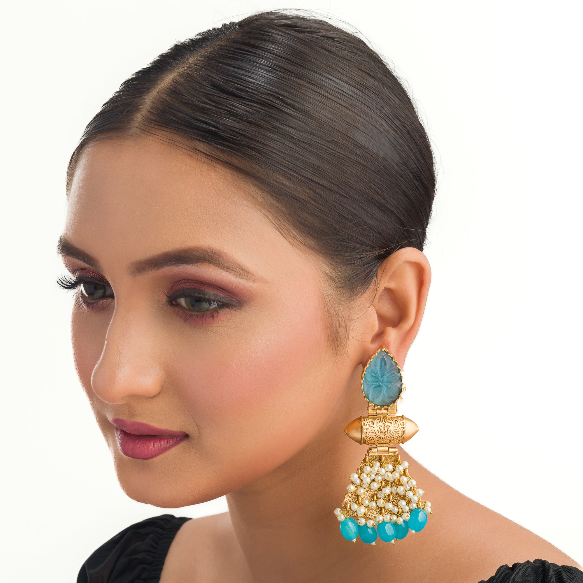 "Blue earrings with gold-tone polish combine vibrant color and a sophisticated finish."
