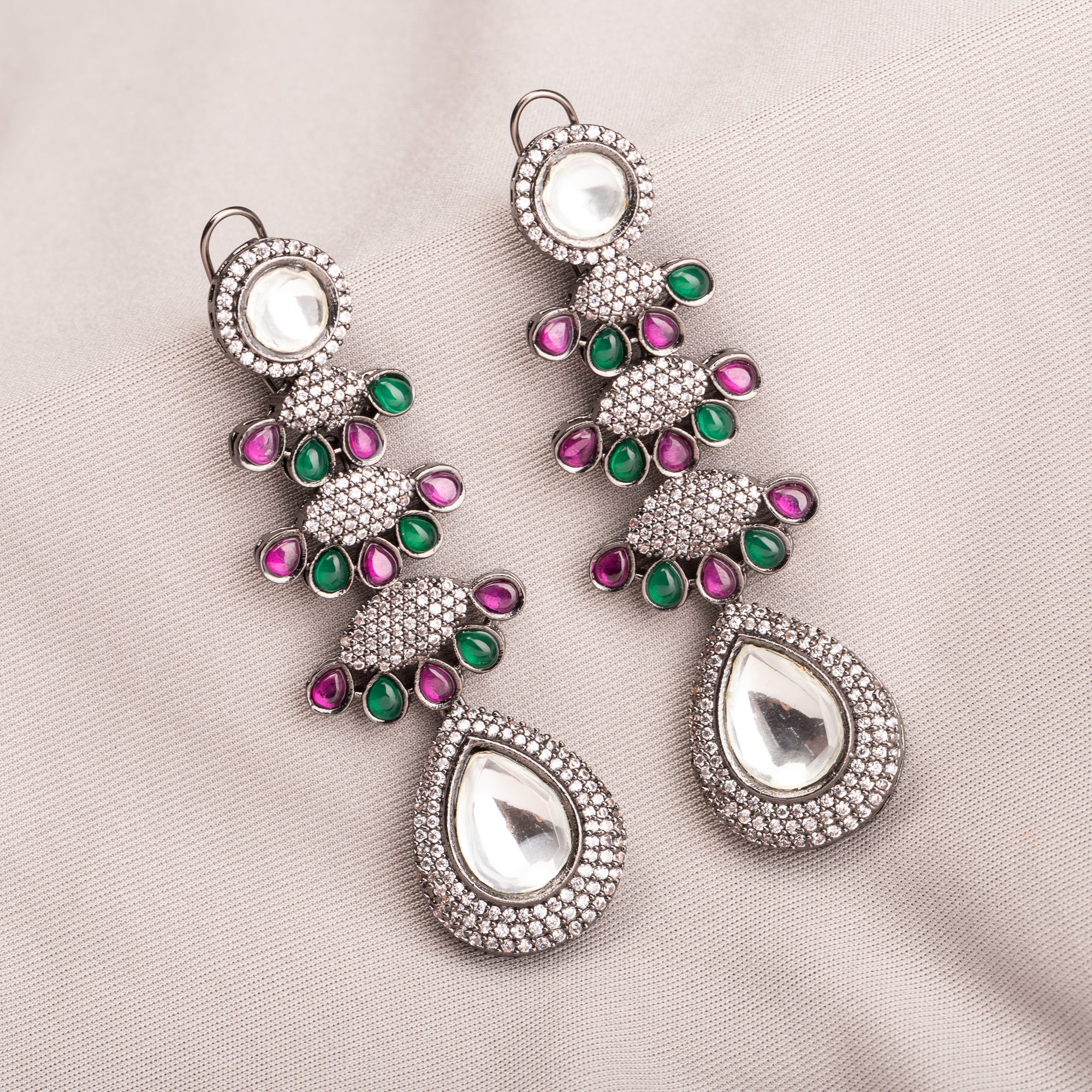 "Pink, white, and green zircon earrings offer a colorful, elegant sparkle for any look."
