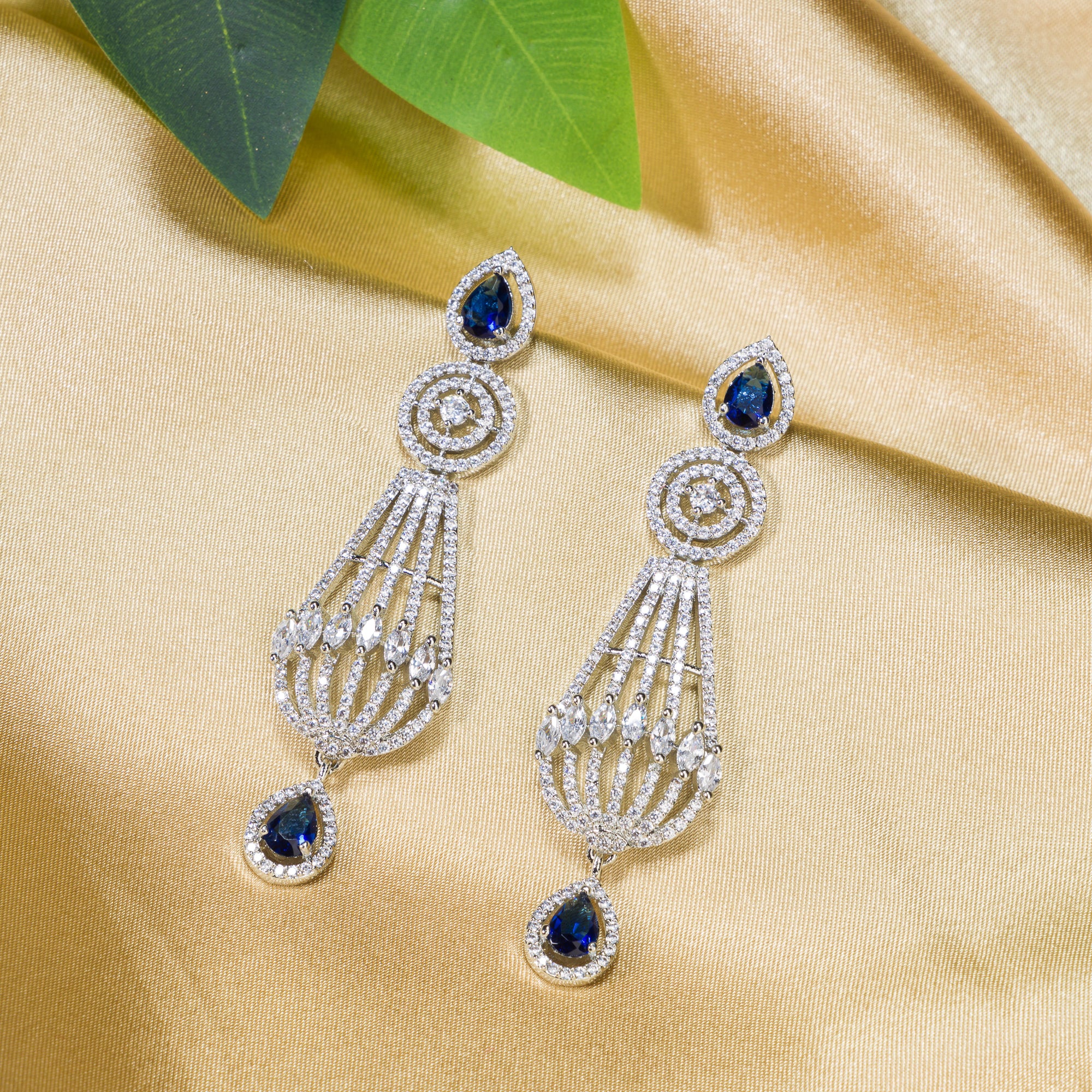 "Navy blue zircon earrings add a vibrant, elegant sparkle to your ensemble."