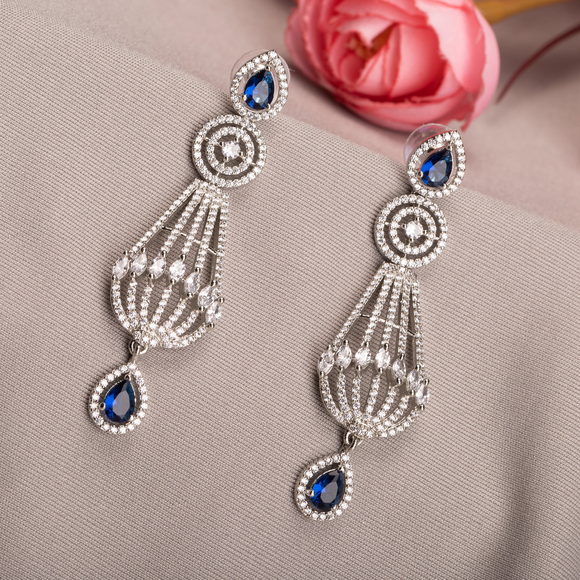 "Navy blue zircon earrings add a vibrant, elegant sparkle to your ensemble."