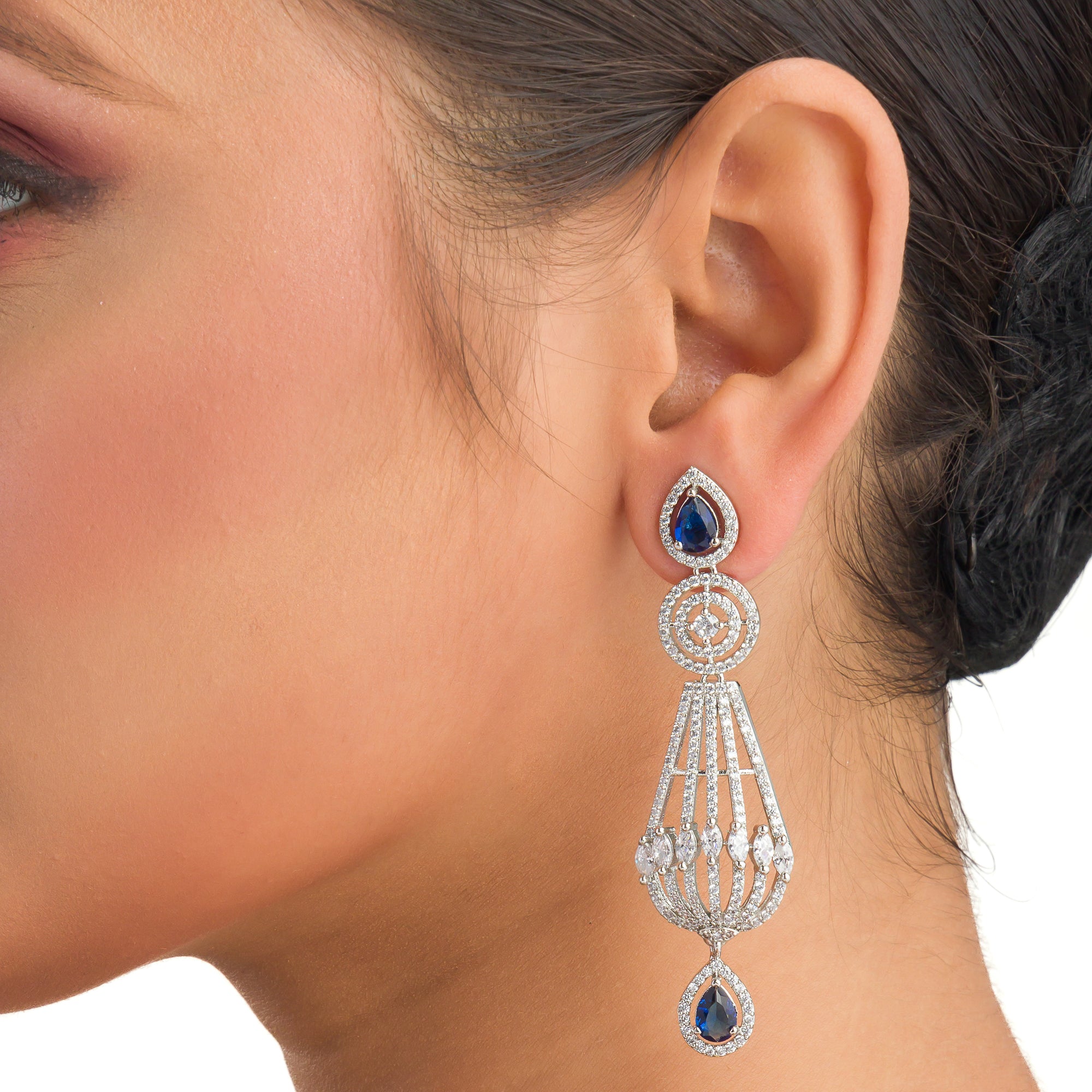 "Navy blue zircon earrings add a vibrant, elegant sparkle to your ensemble."