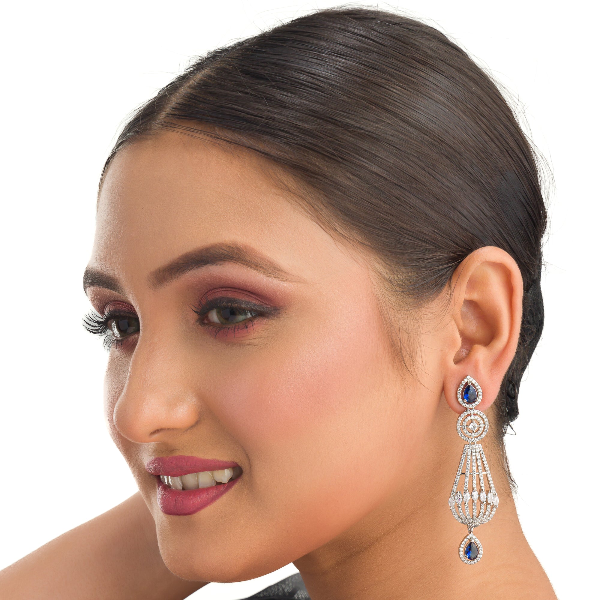 "Navy blue zircon earrings add a vibrant, elegant sparkle to your ensemble."