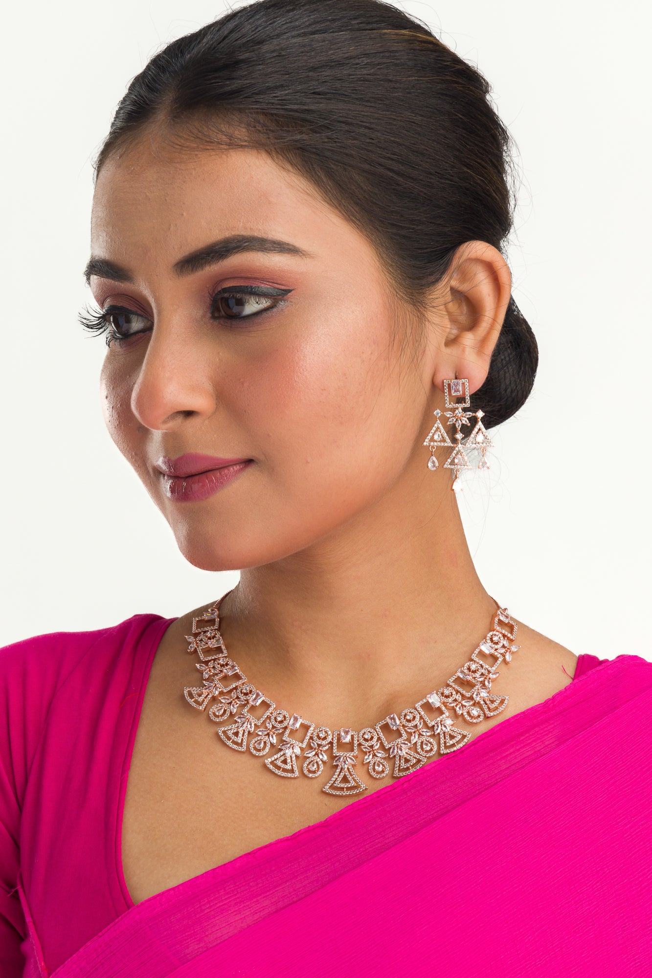 "Rose gold zircon necklace combines subtle shimmer with elegant tones."