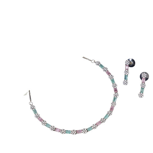 "Zircon silver necklace with pink and green accents adds a delicate, colorful touch."