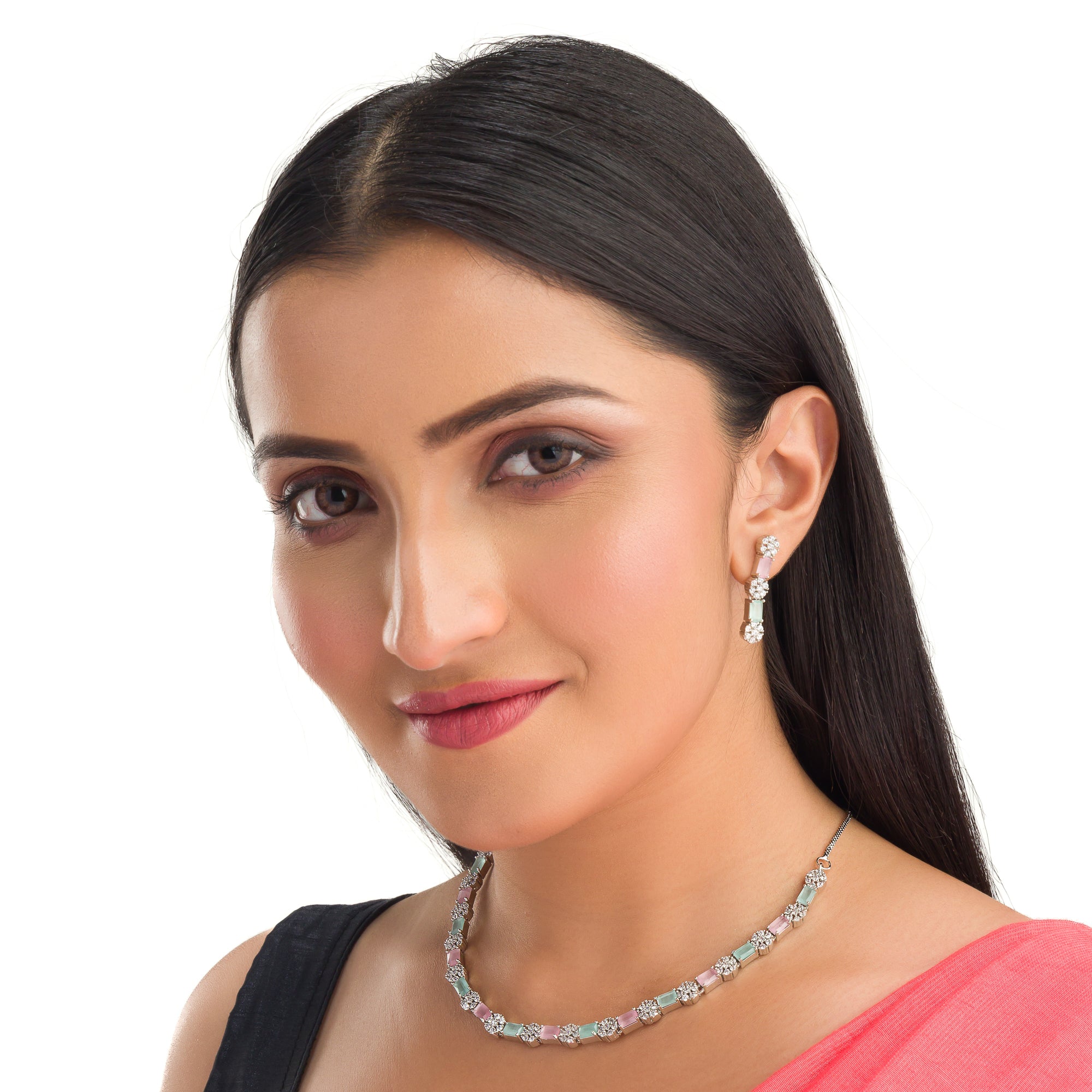 "Zircon silver necklace with pink and green accents adds a delicate, colorful touch."