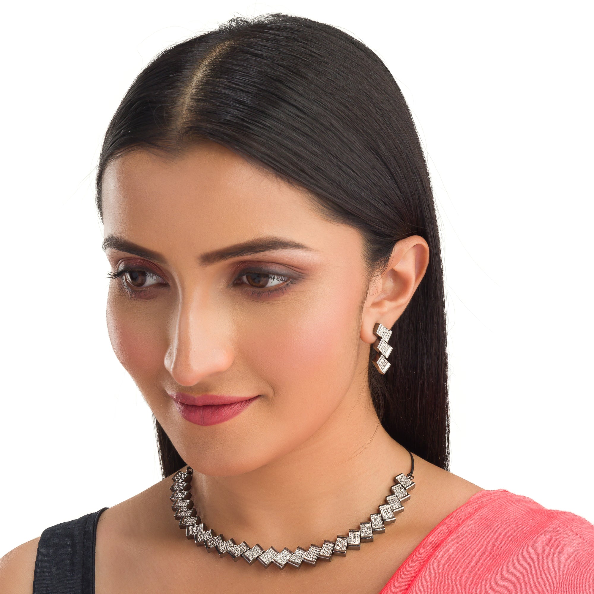 "Zigzag-shaped zircon necklace adds a modern twist to classic sparkle."