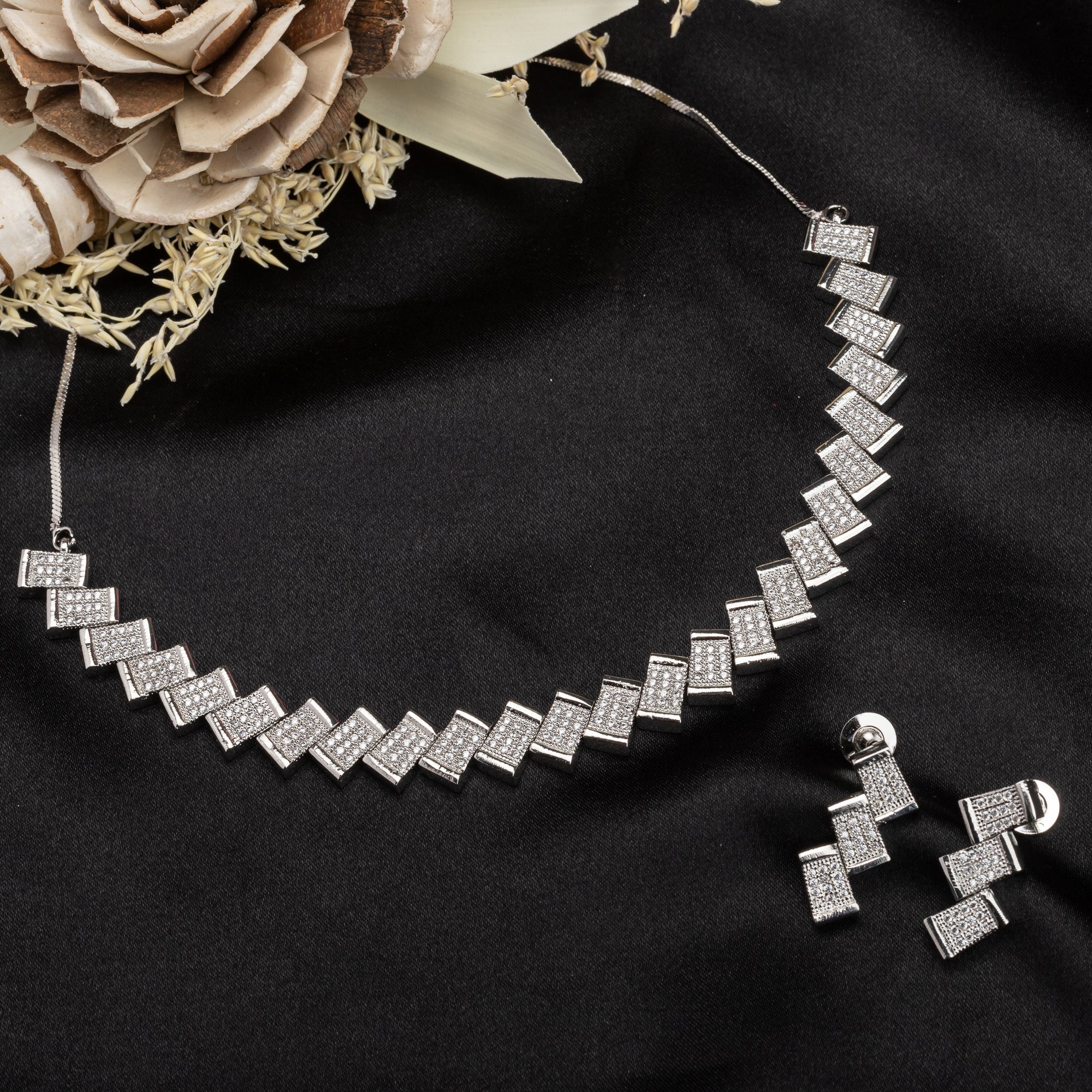 "Zigzag-shaped zircon necklace adds a modern twist to classic sparkle."