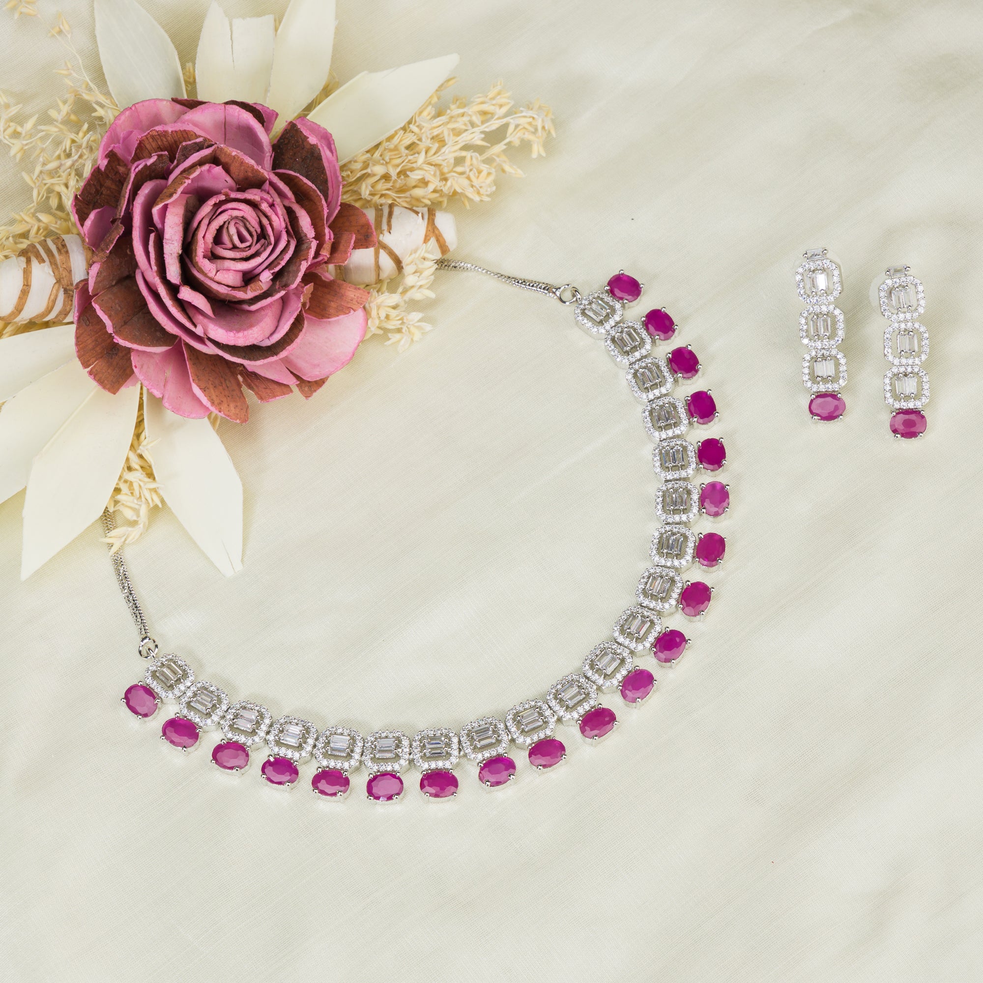 "Pink zircon necklace set features vibrant, elegant charm."