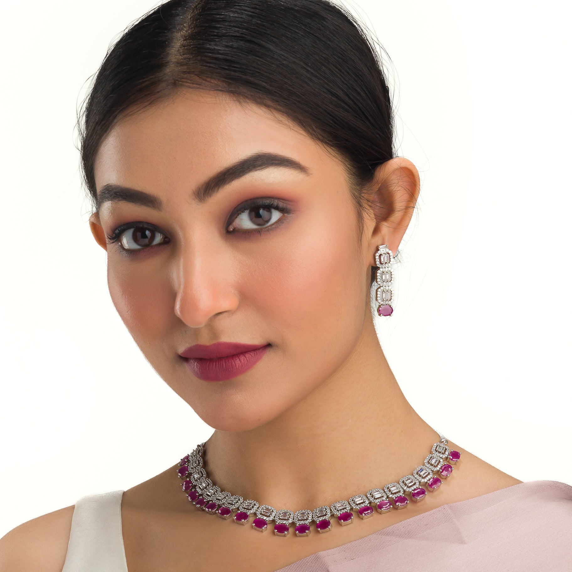"Pink zircon necklace set features vibrant, elegant charm."