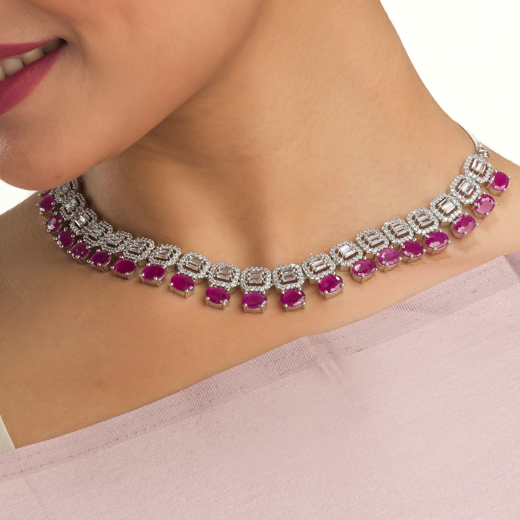 "Pink zircon necklace set features vibrant, elegant charm."