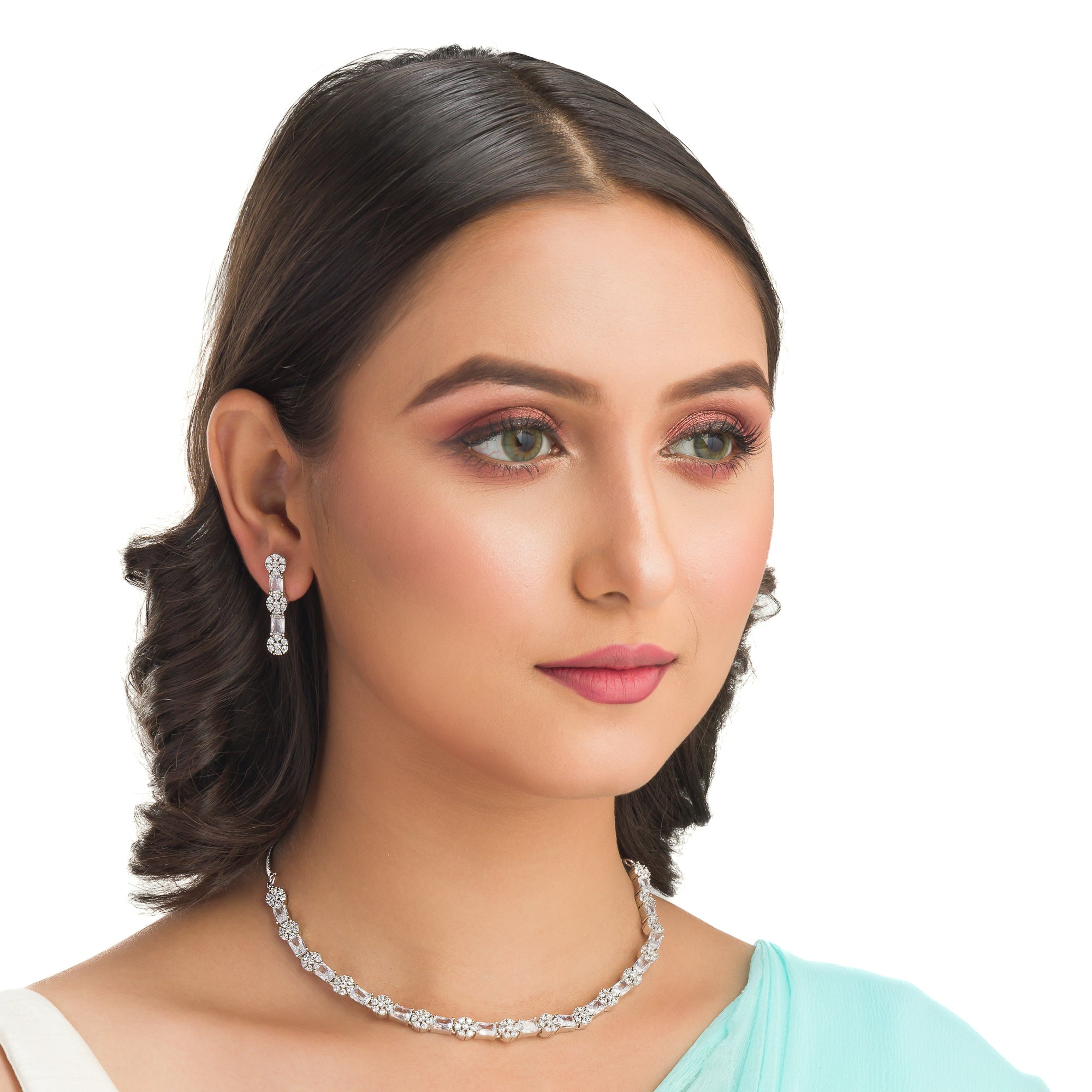 "Delicate zircon necklace with small flower design adds elegance and sparkle."