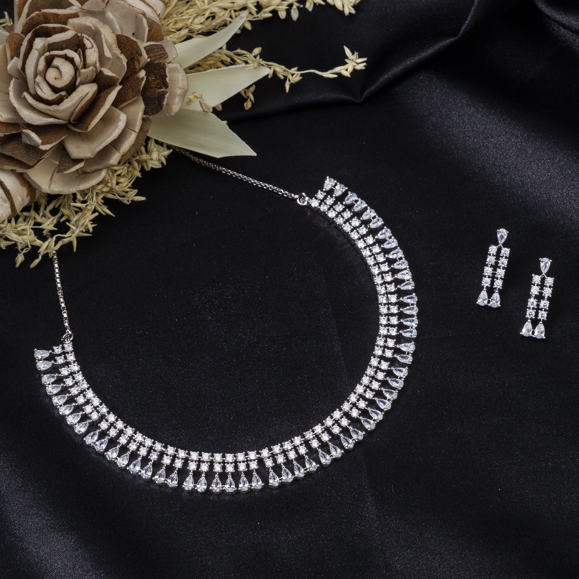 "White zircon necklace offers timeless elegance with sparkling clarity."