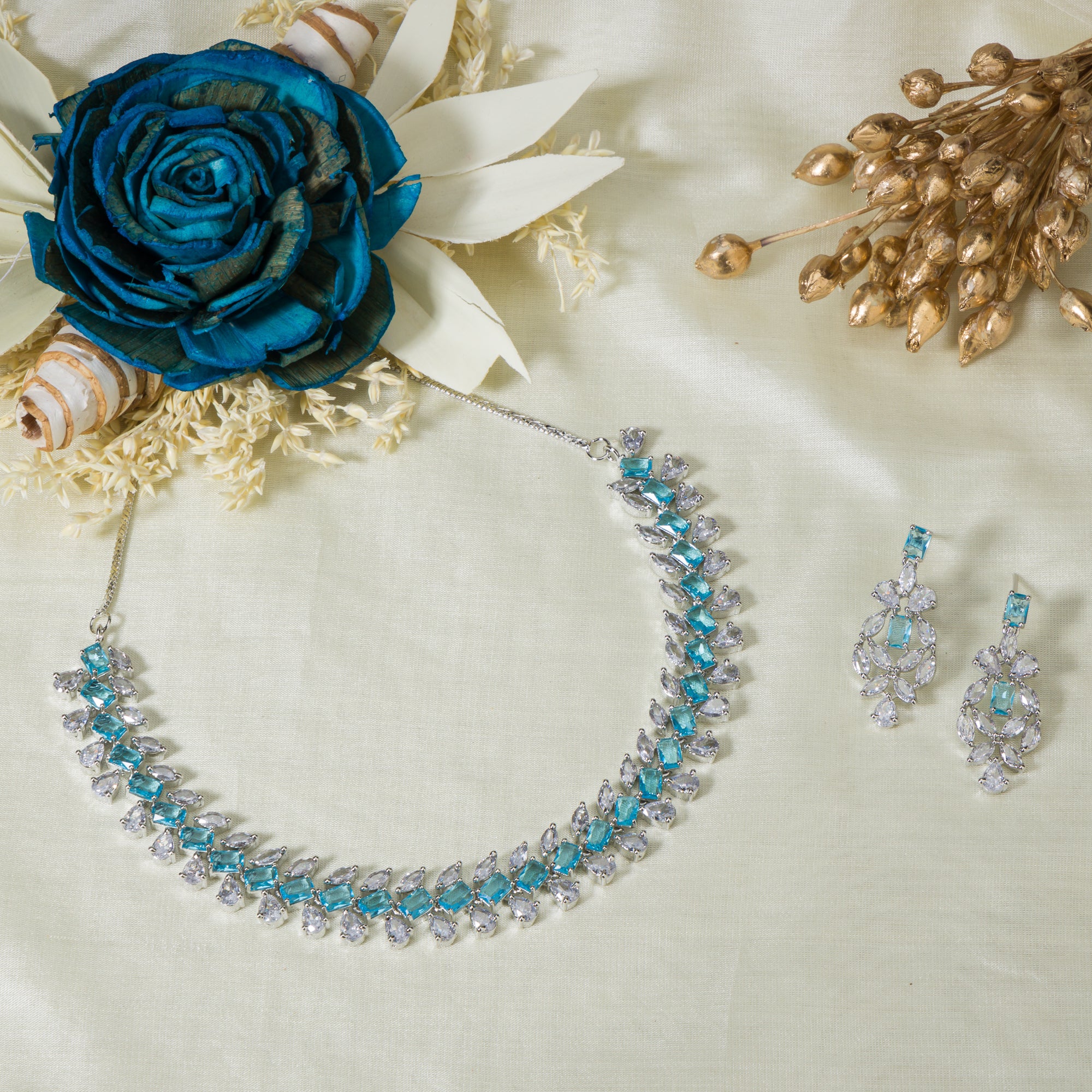 "Aqua blue zircon necklace with square stone offers a vibrant, stylish touch."