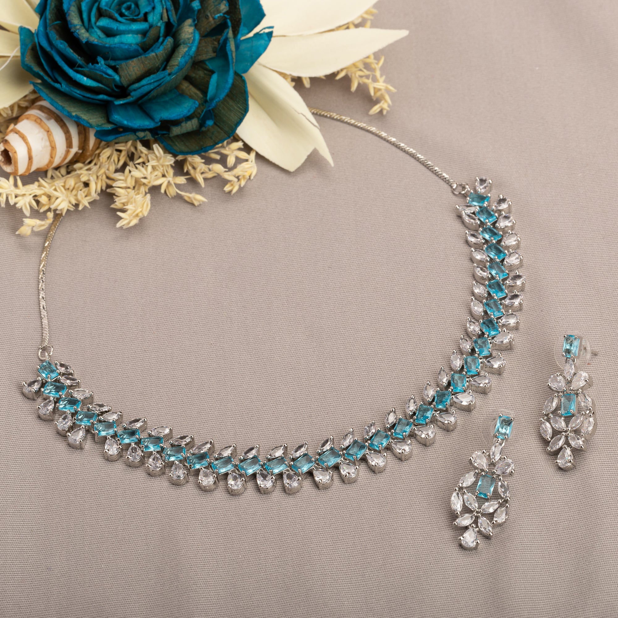 "Aqua blue zircon necklace with square stone offers a vibrant, stylish touch."
