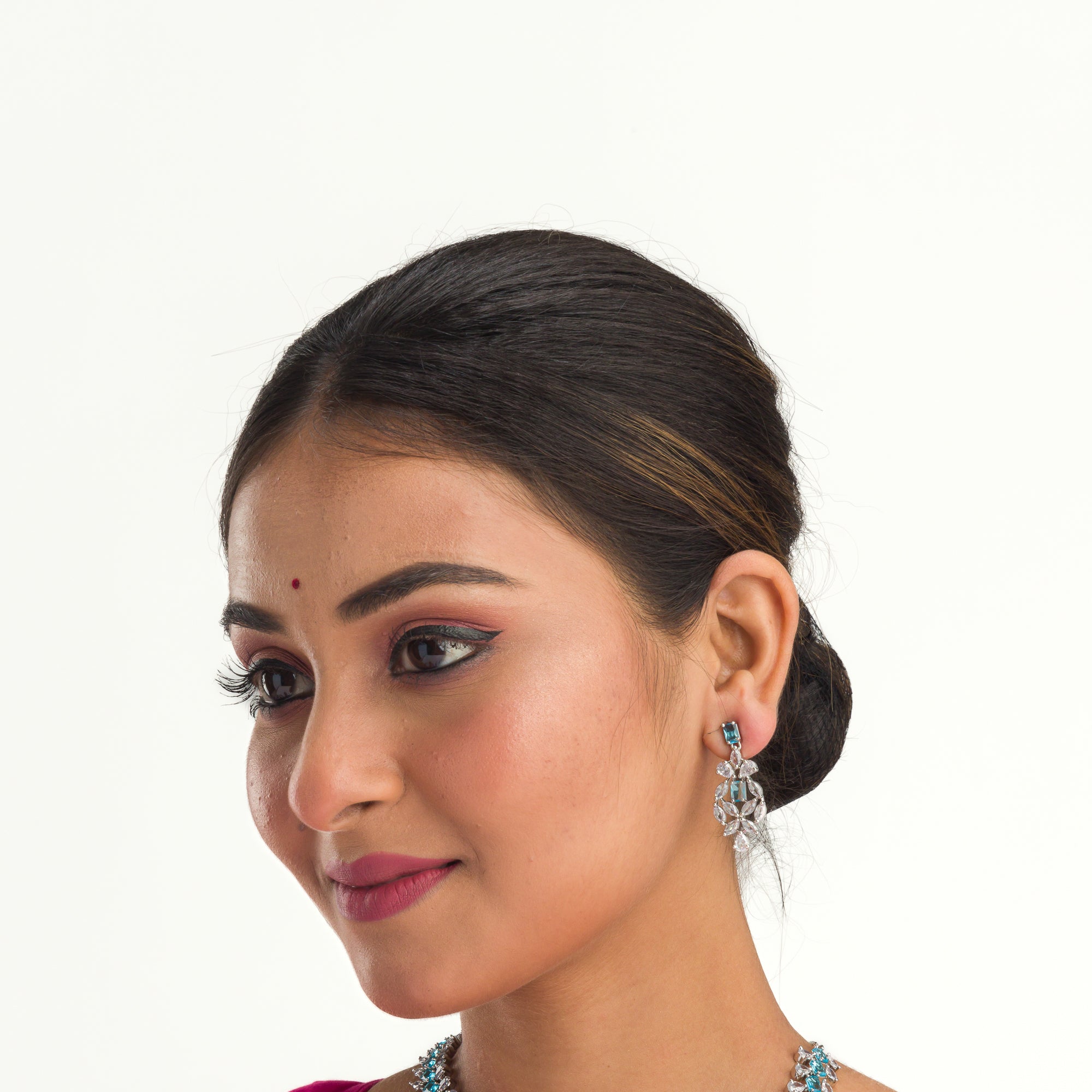 "Aqua blue zircon necklace with square stone offers a vibrant, stylish touch."