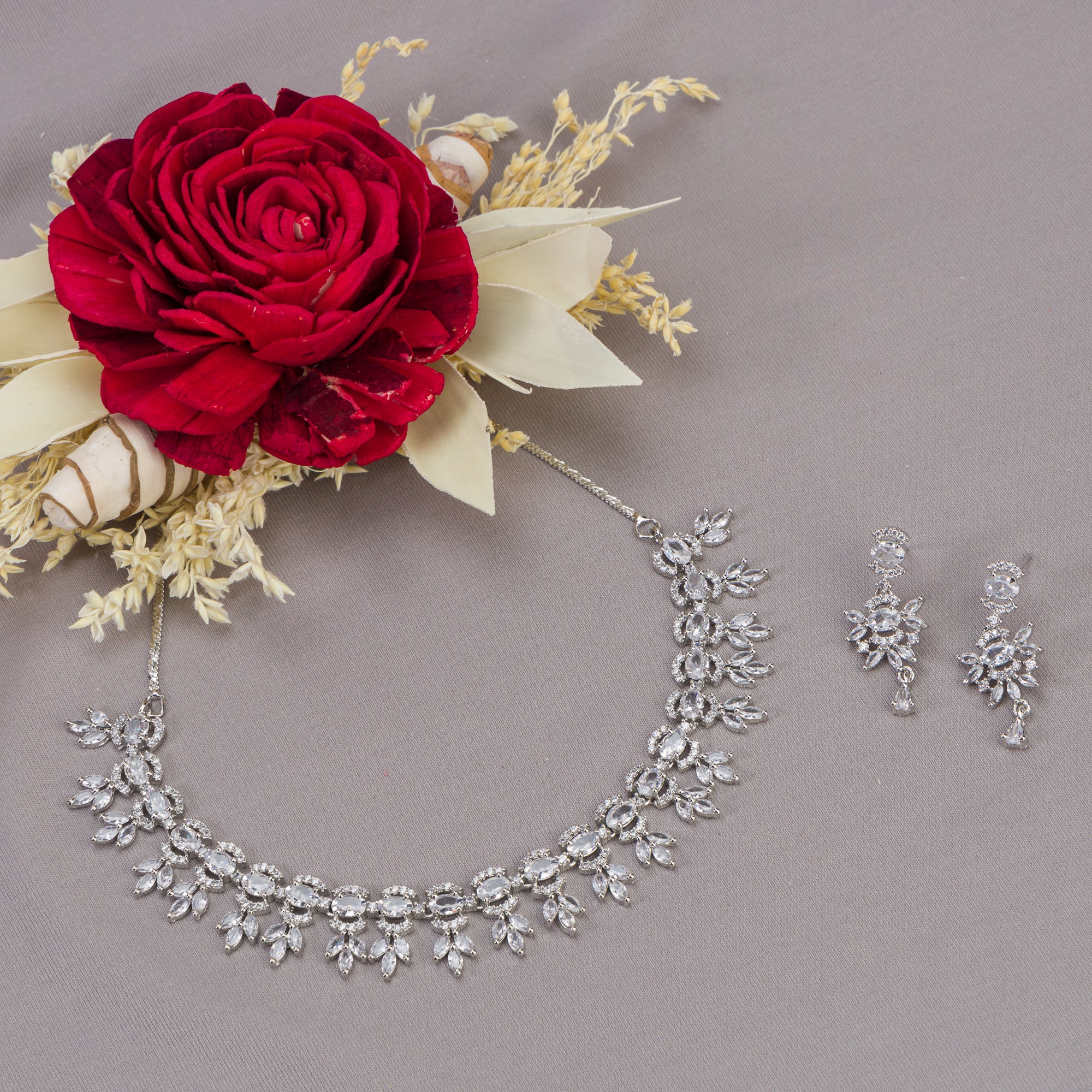 "White zircon necklace adds classic elegance with sparkling clarity.