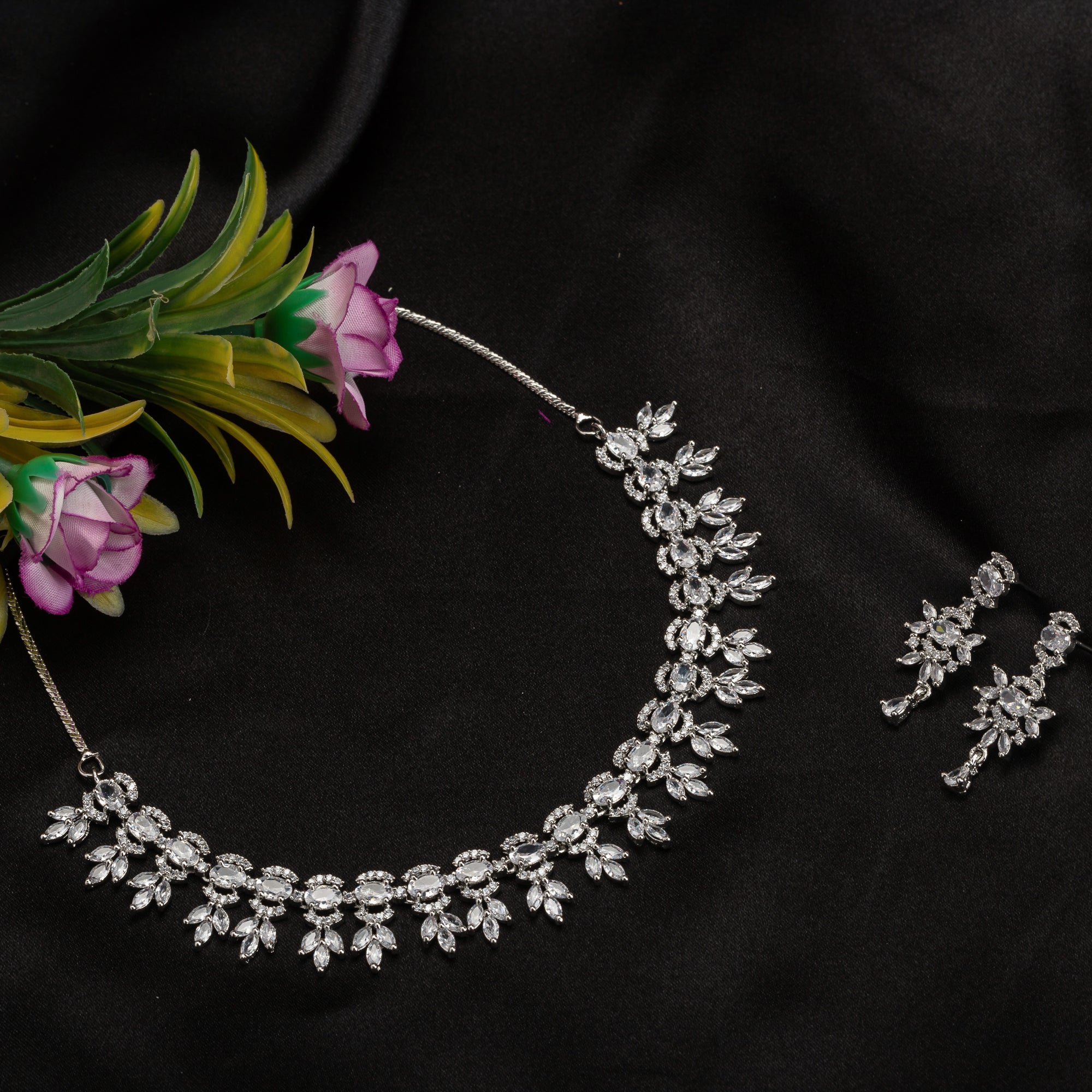 "White zircon necklace adds classic elegance with sparkling clarity.