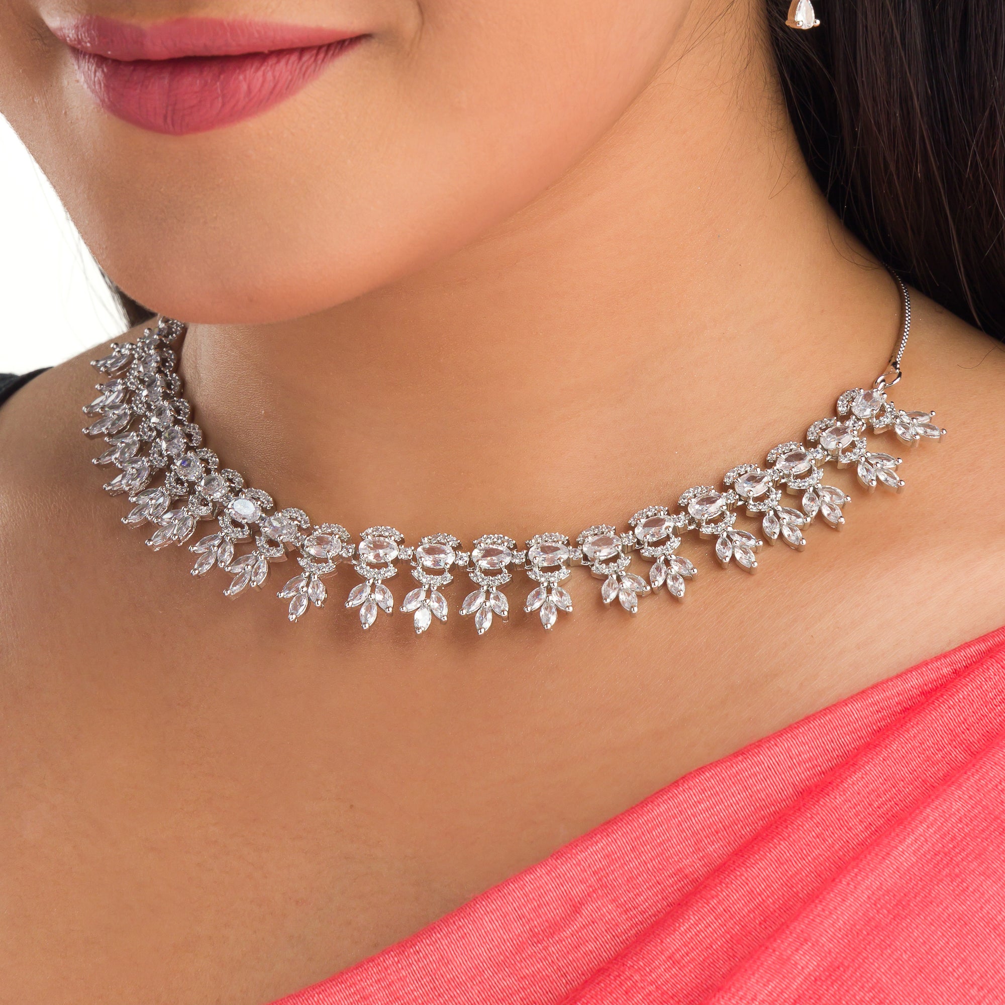 "White zircon necklace adds classic elegance with sparkling clarity.