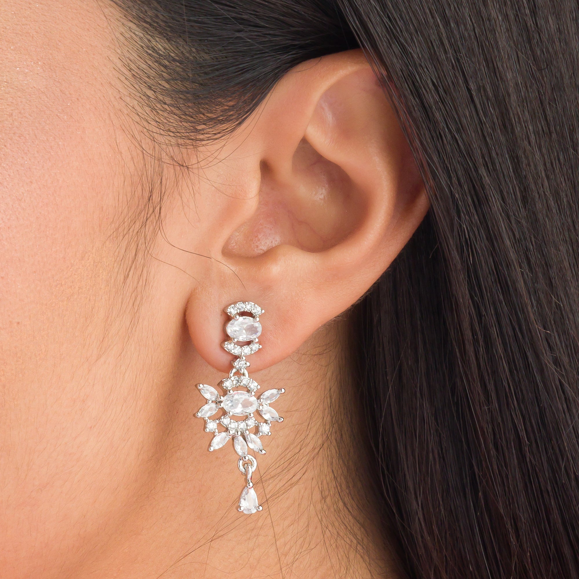 "White zircon necklace adds classic elegance with sparkling clarity.