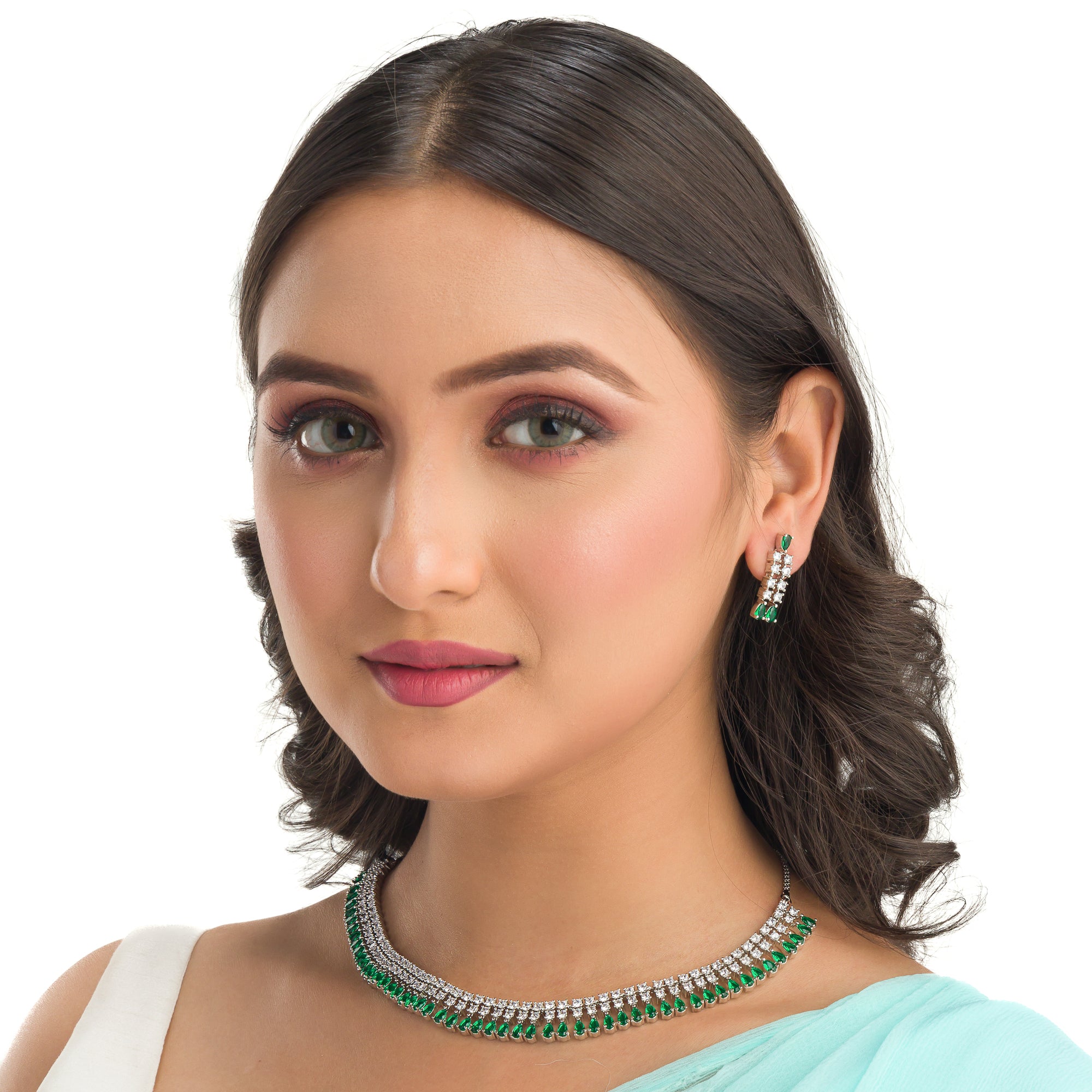 "Zircon necklace with white and green stones adds a vibrant, elegant touch."
