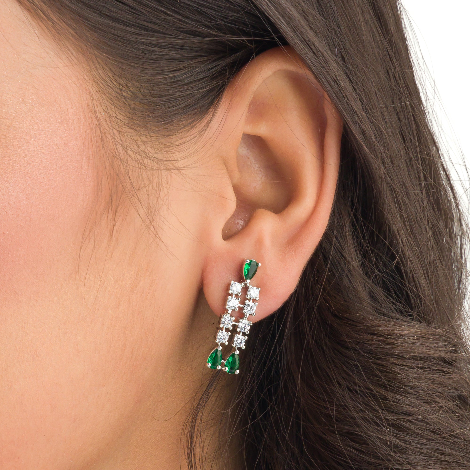 "Zircon necklace with white and green stones adds a vibrant, elegant touch."