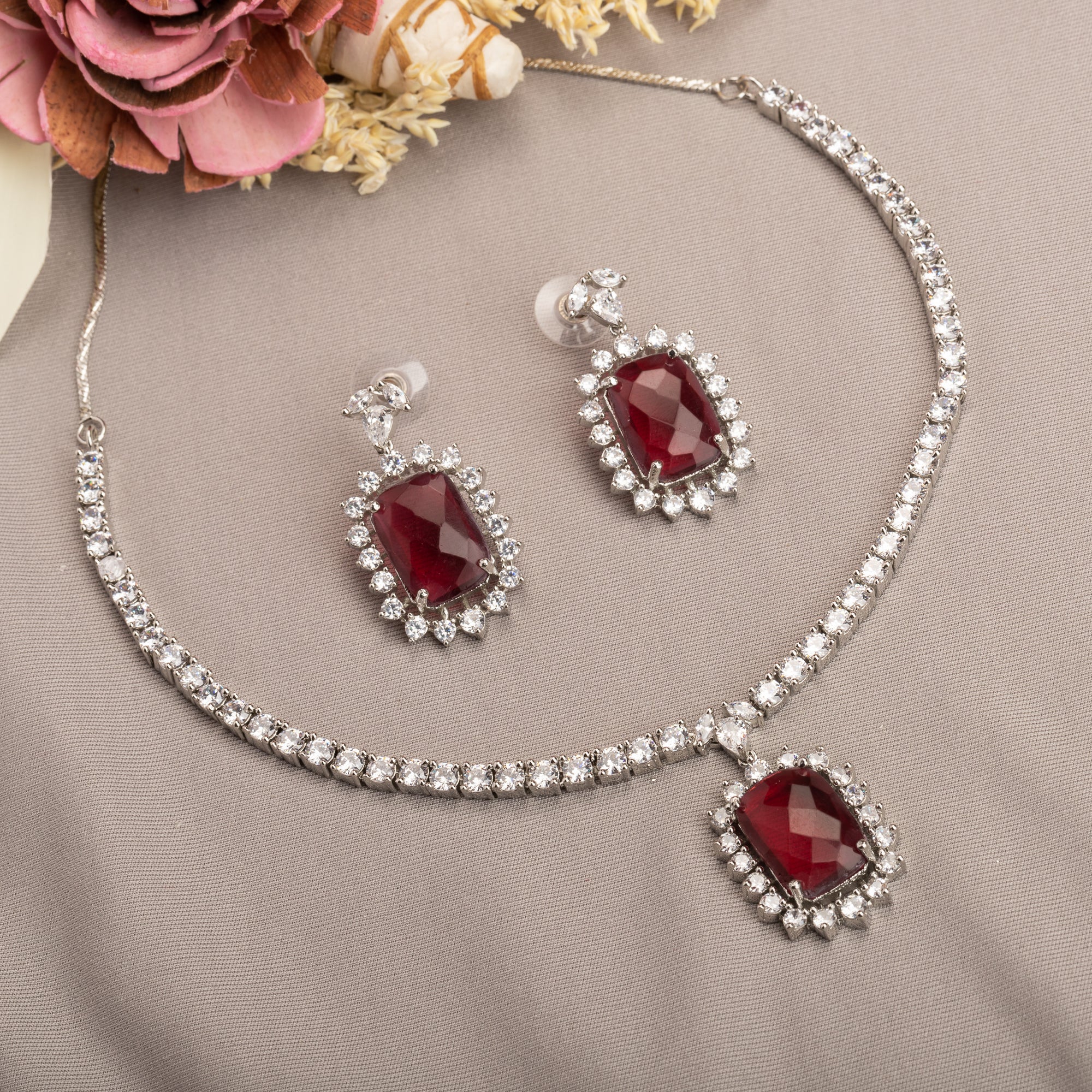 "Rich maroon zircon pendant necklace adds sophistication and elegance."