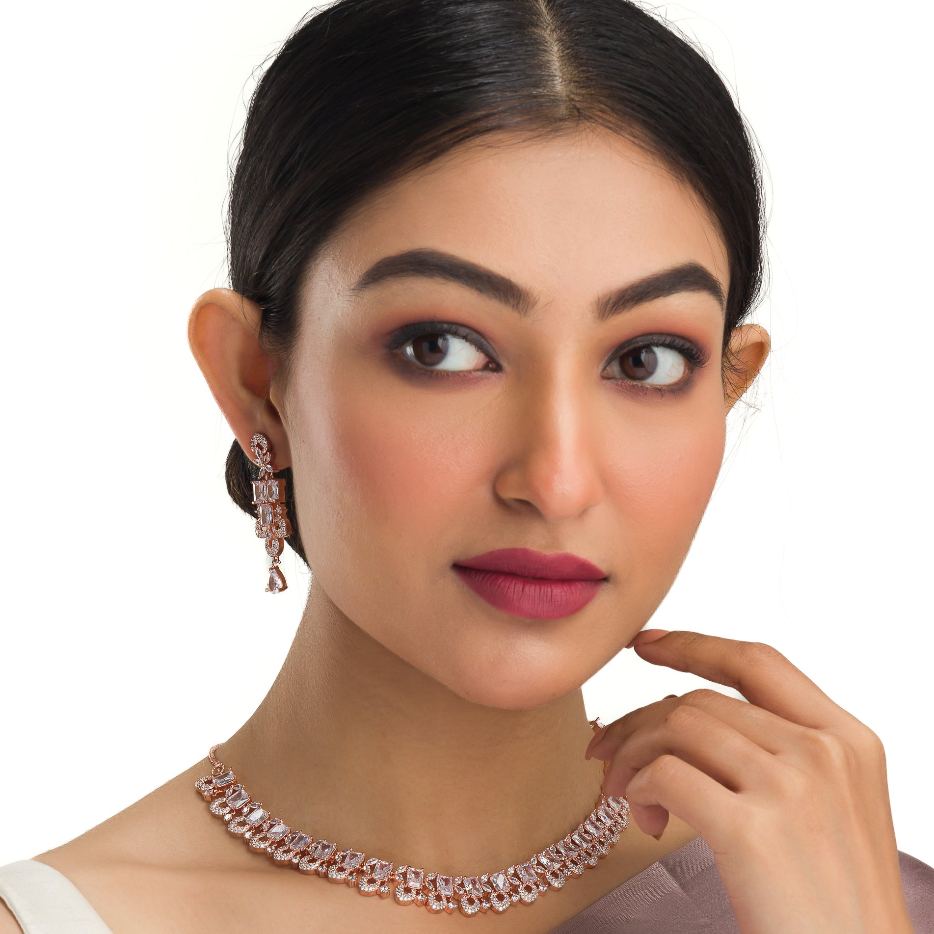 "Understated zircon necklace in silver and rose gold adds timeless elegance."