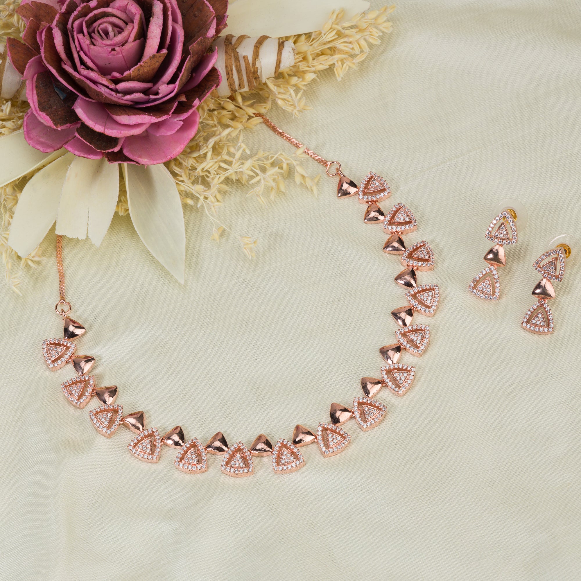 "Triangular rose gold zircon necklace adds sleek, modern sophistication to your look."