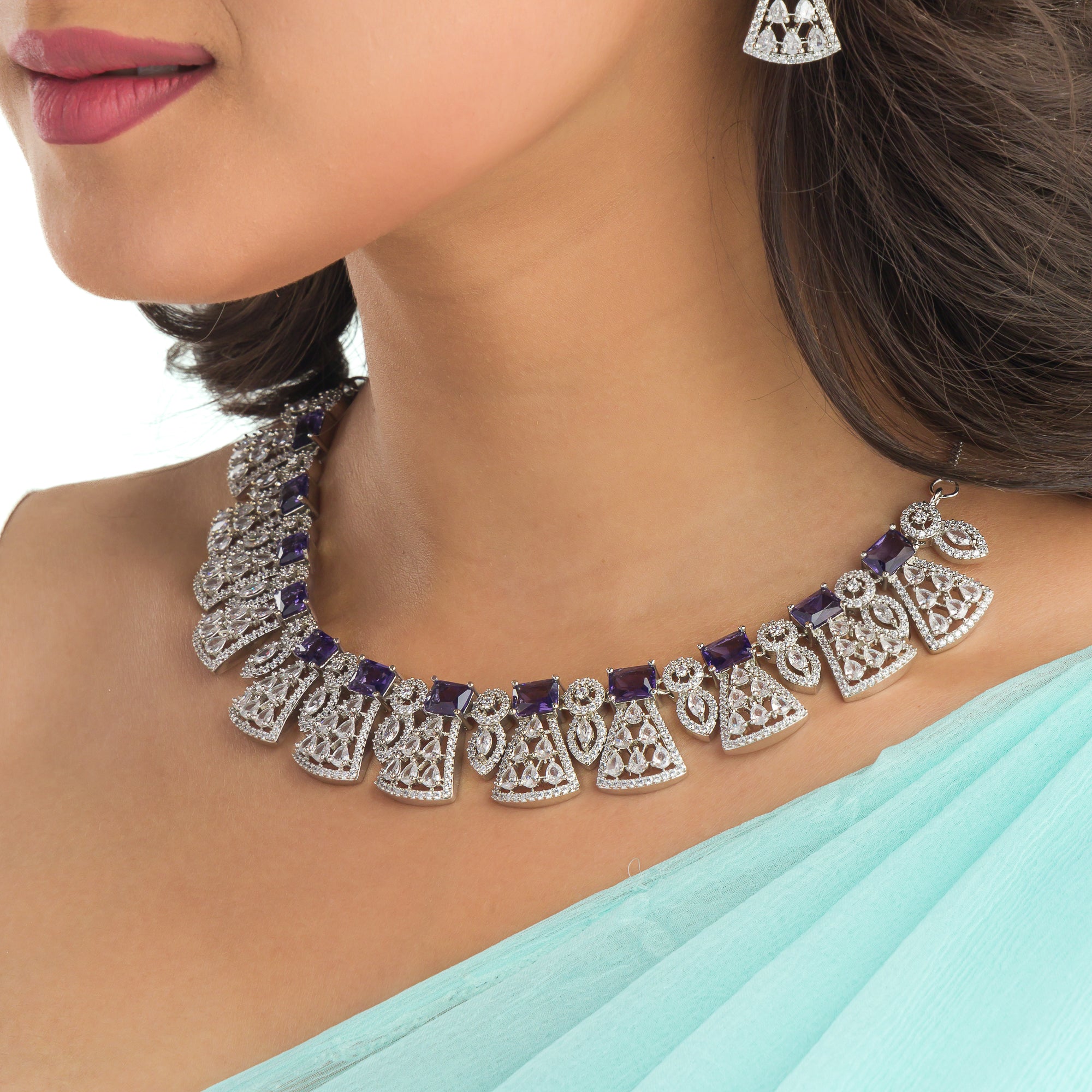 "Navy blue zircon necklace set with maang tikka exudes elegant coordination and style."
