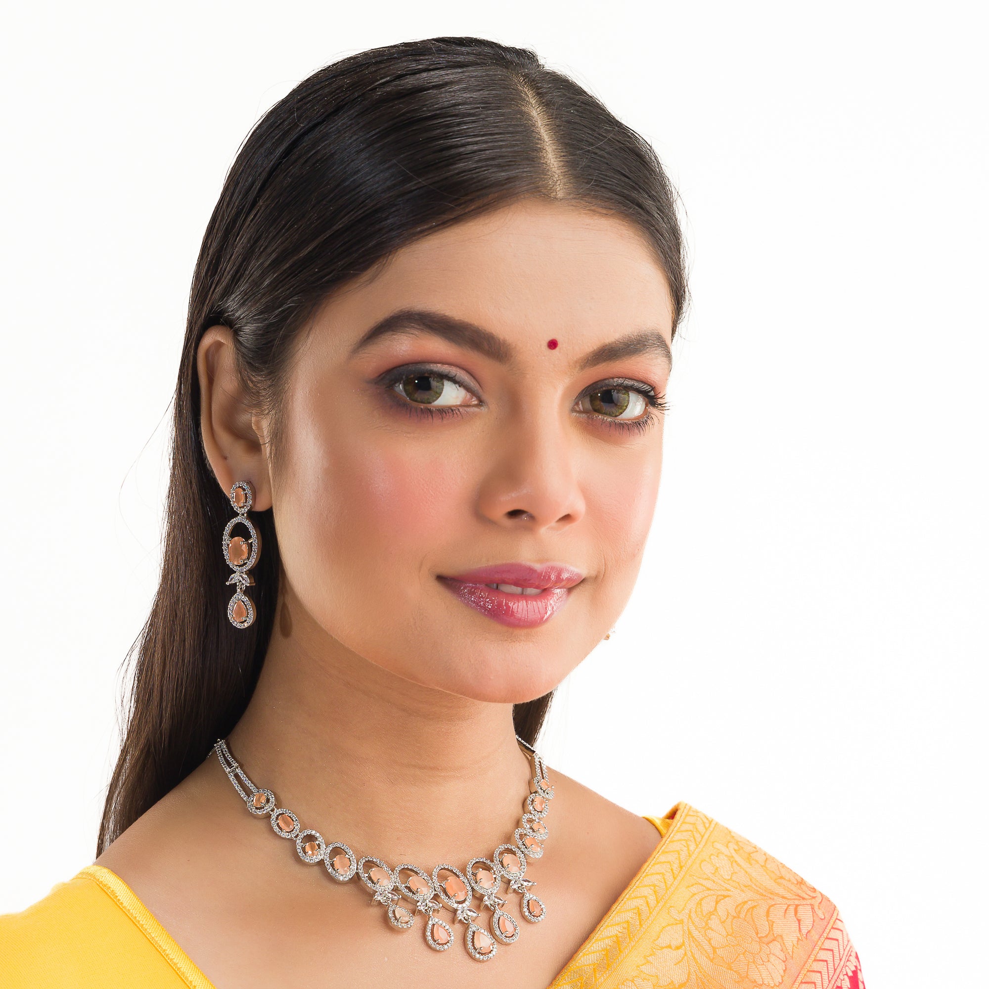 "Salmon zircon necklace with white zircons adds vibrant sparkle for a lively, chic look."