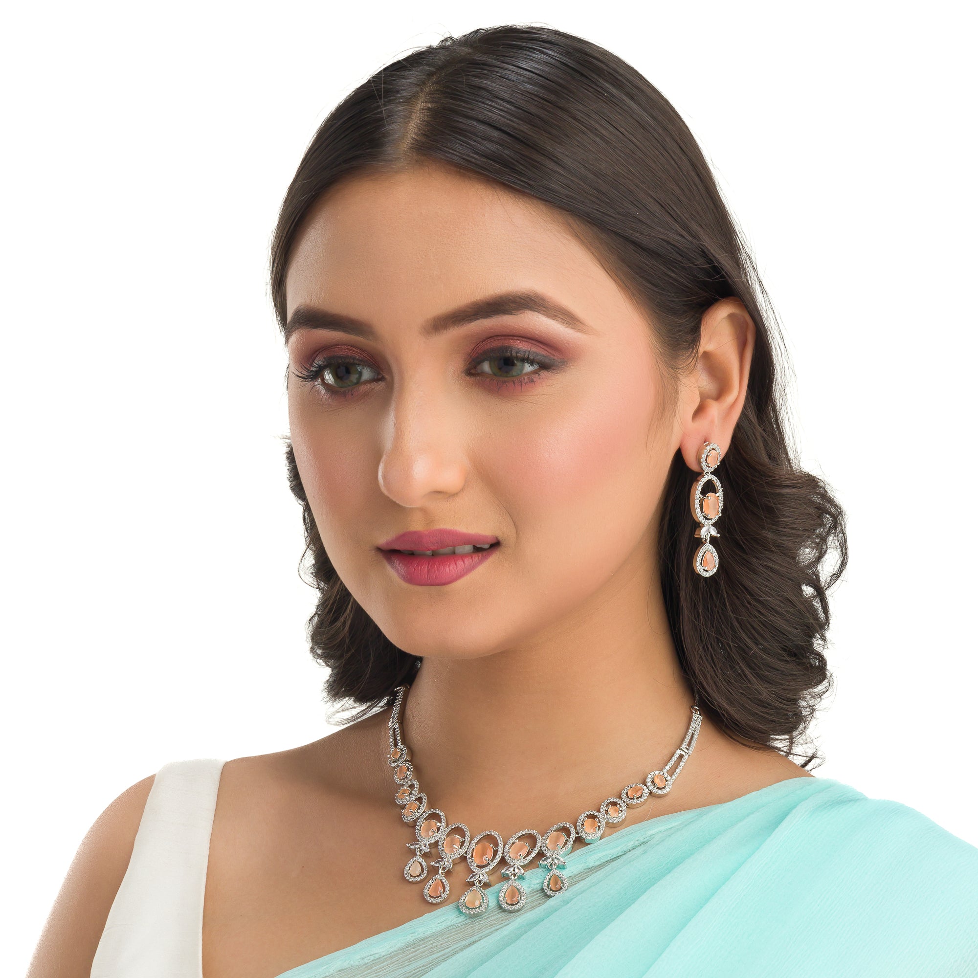 "Salmon zircon necklace with white zircons adds vibrant sparkle for a lively, chic look."