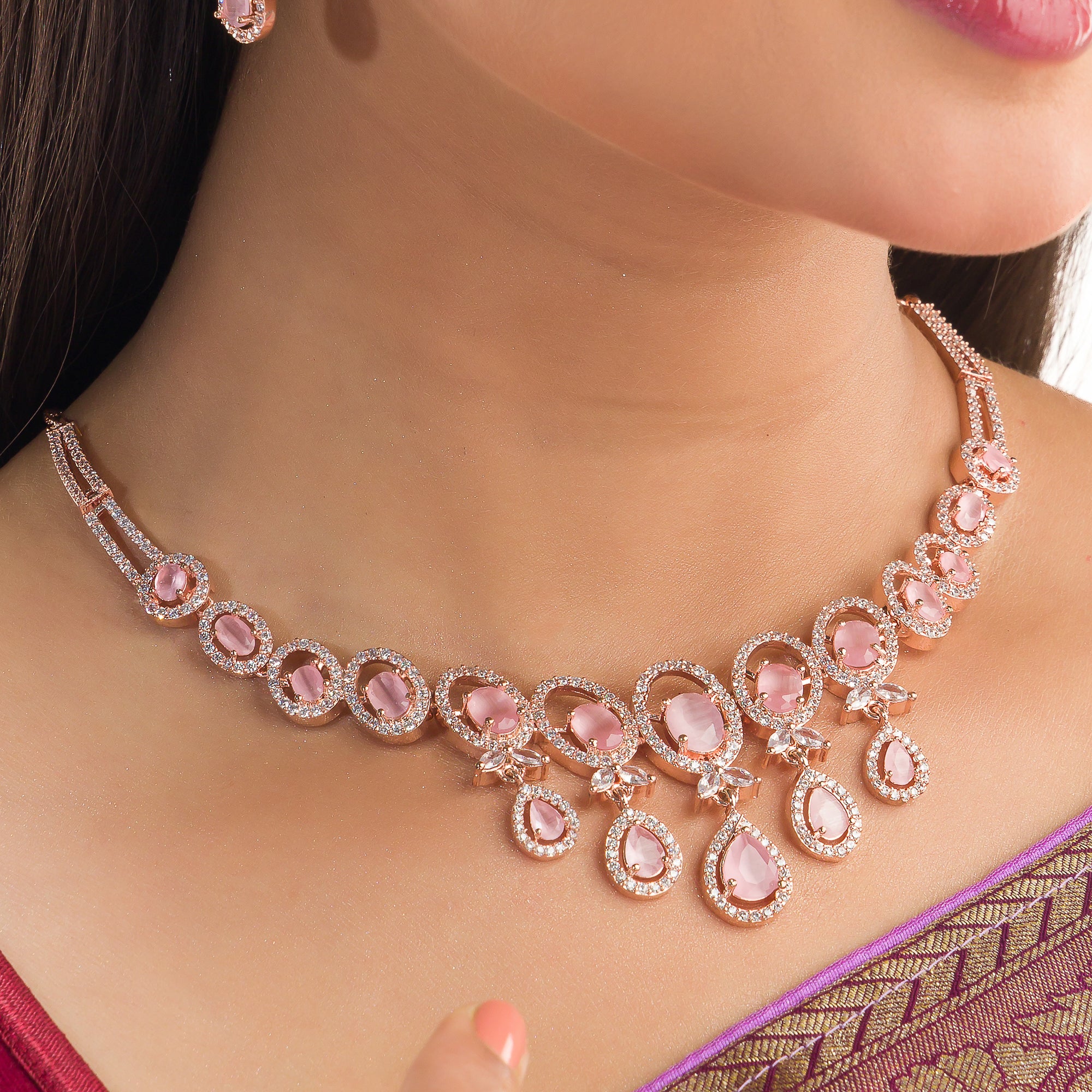 Pink zircon necklace with rose gold polish adds a chic and elegant finishing touch