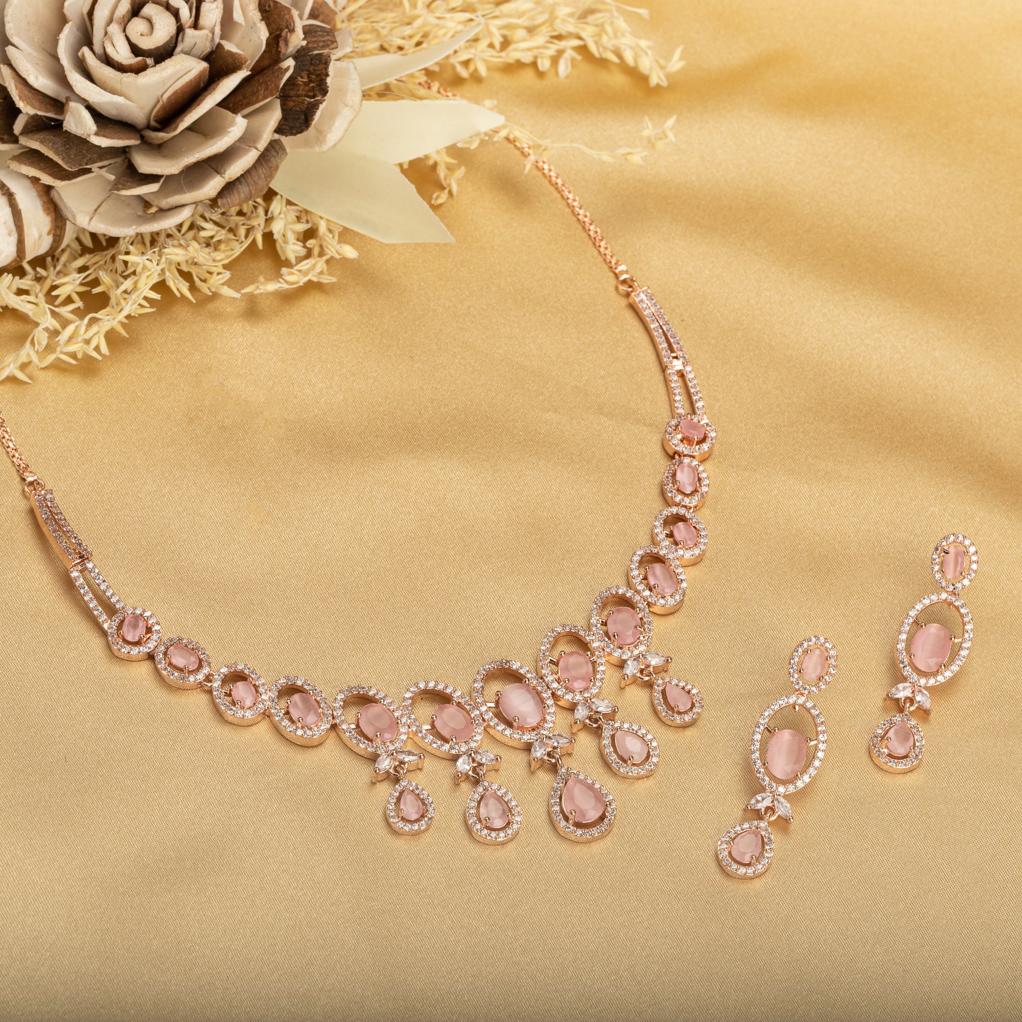Pink zircon necklace with rose gold polish adds a chic and elegant finishing touch