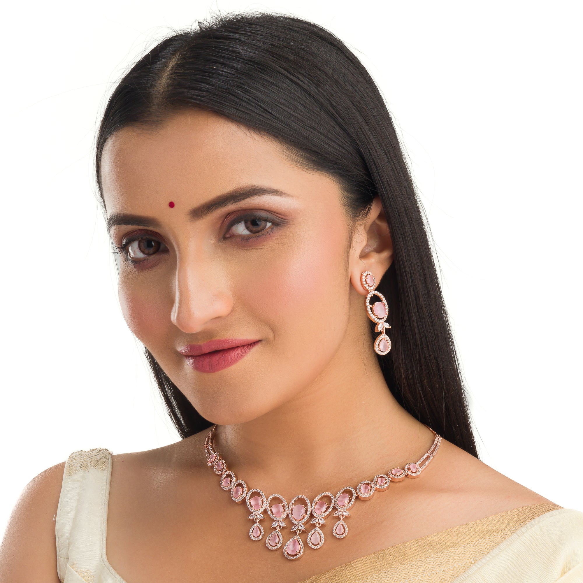 Pink zircon necklace with rose gold polish adds a chic and elegant finishing touch