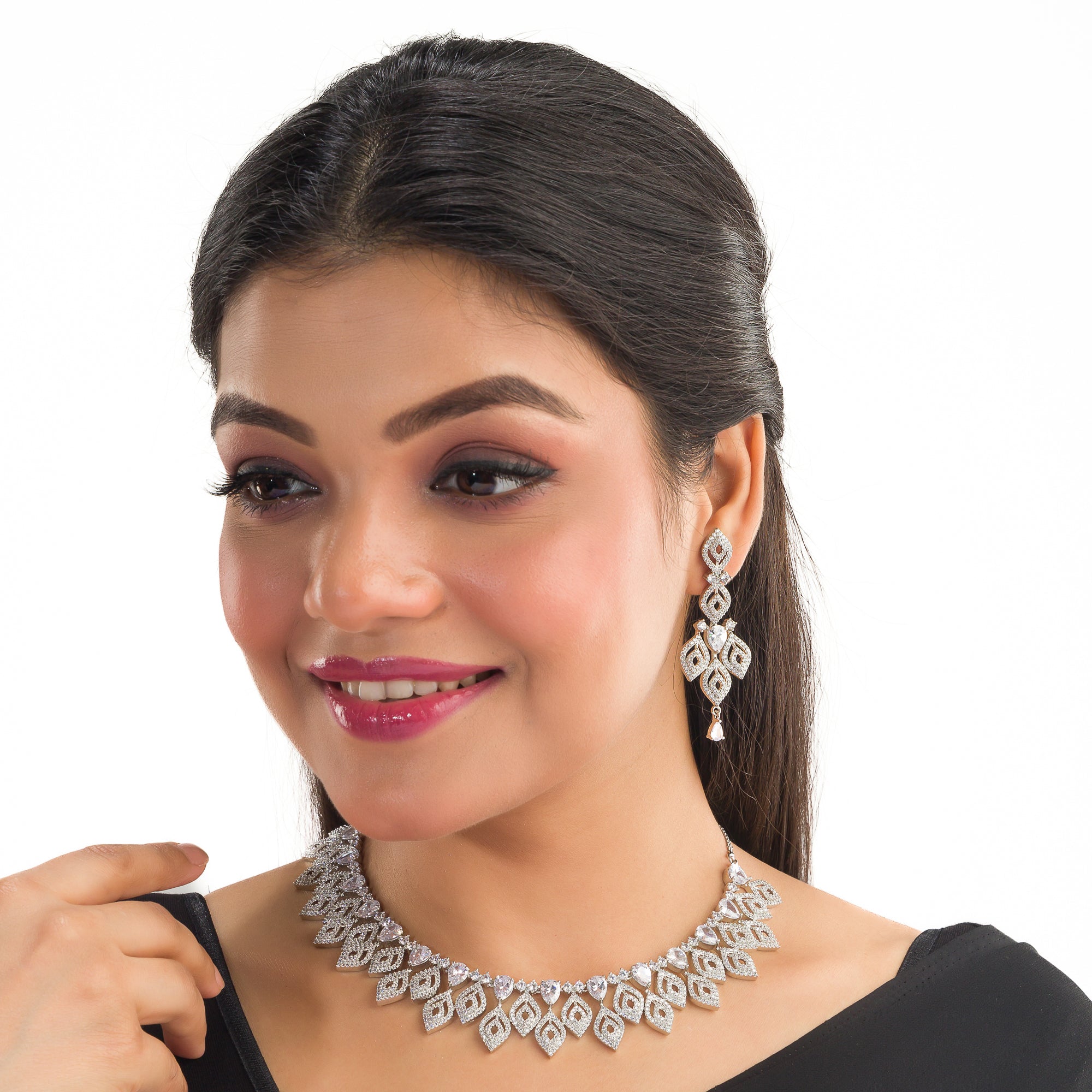 "Silver zircon necklace with leaf motifs adds natural elegance and sophisticated charm."