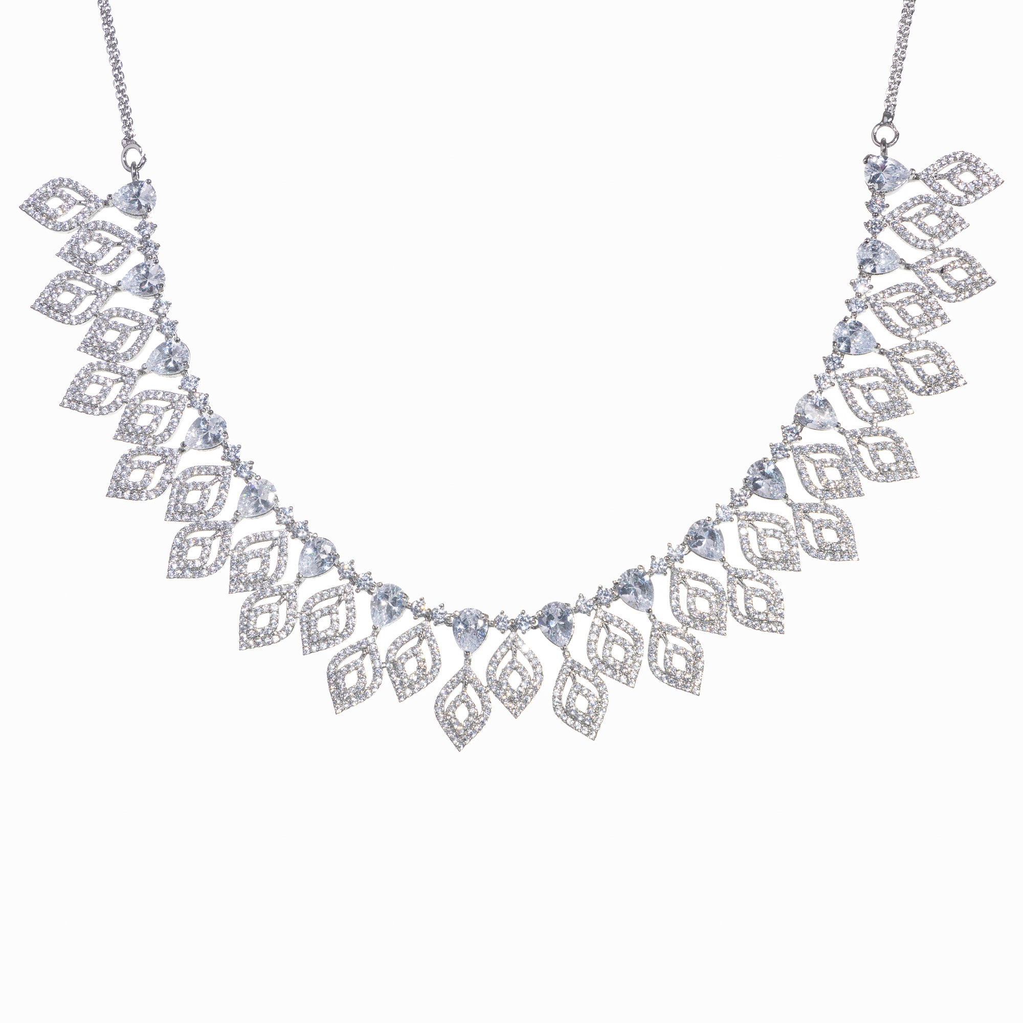 "Silver zircon necklace with leaf motifs adds natural elegance and sophisticated charm."