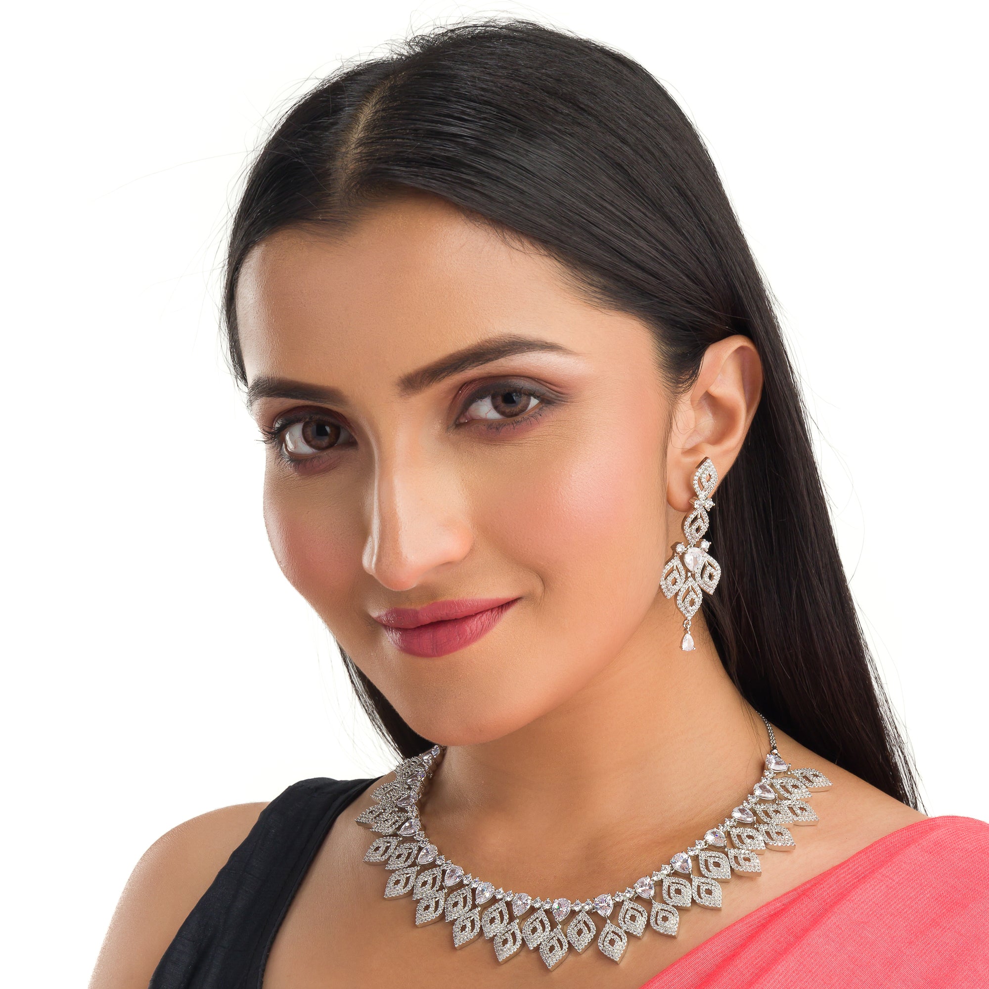 "Silver zircon necklace with leaf motifs adds natural elegance and sophisticated charm."