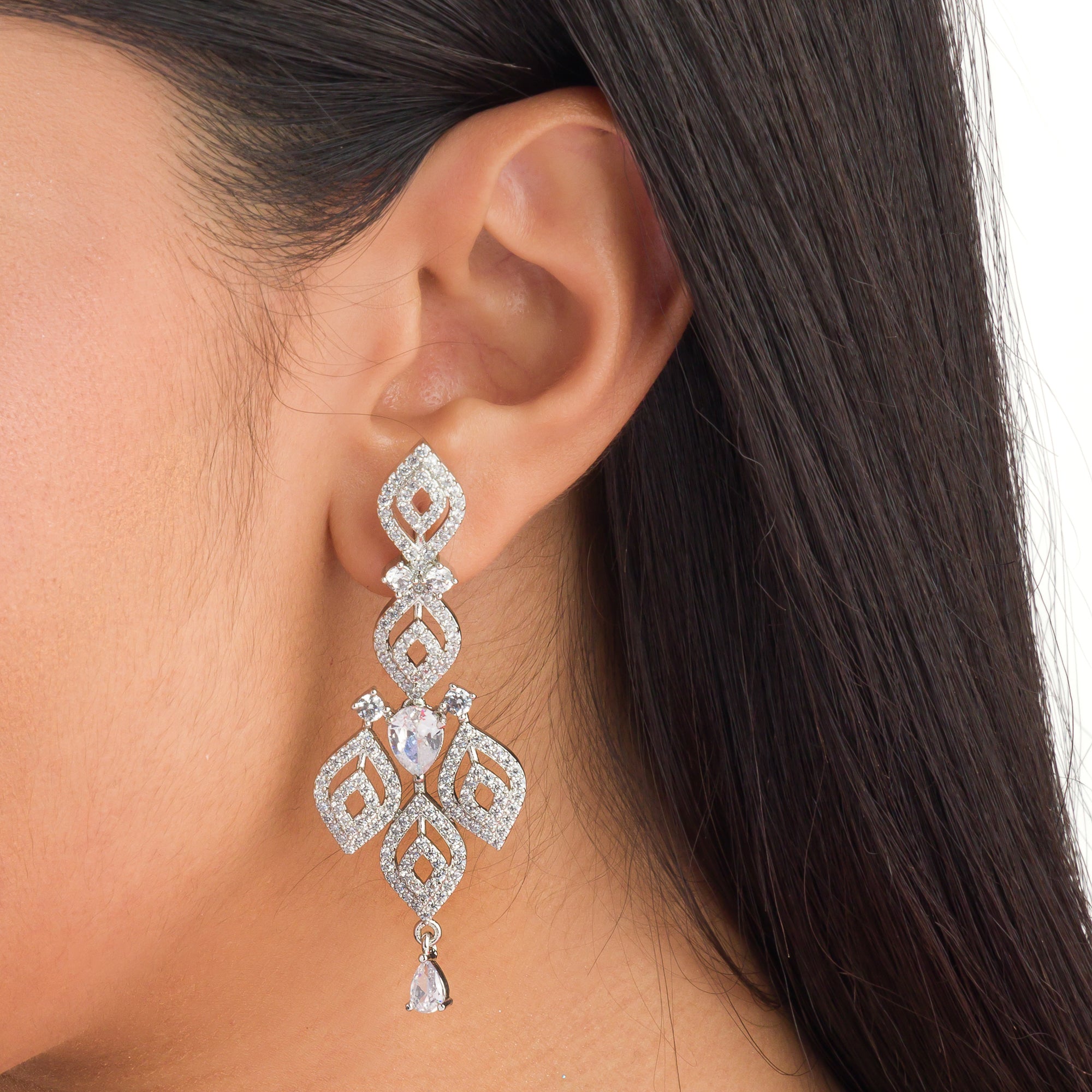 "Silver zircon necklace with leaf motifs adds natural elegance and sophisticated charm."