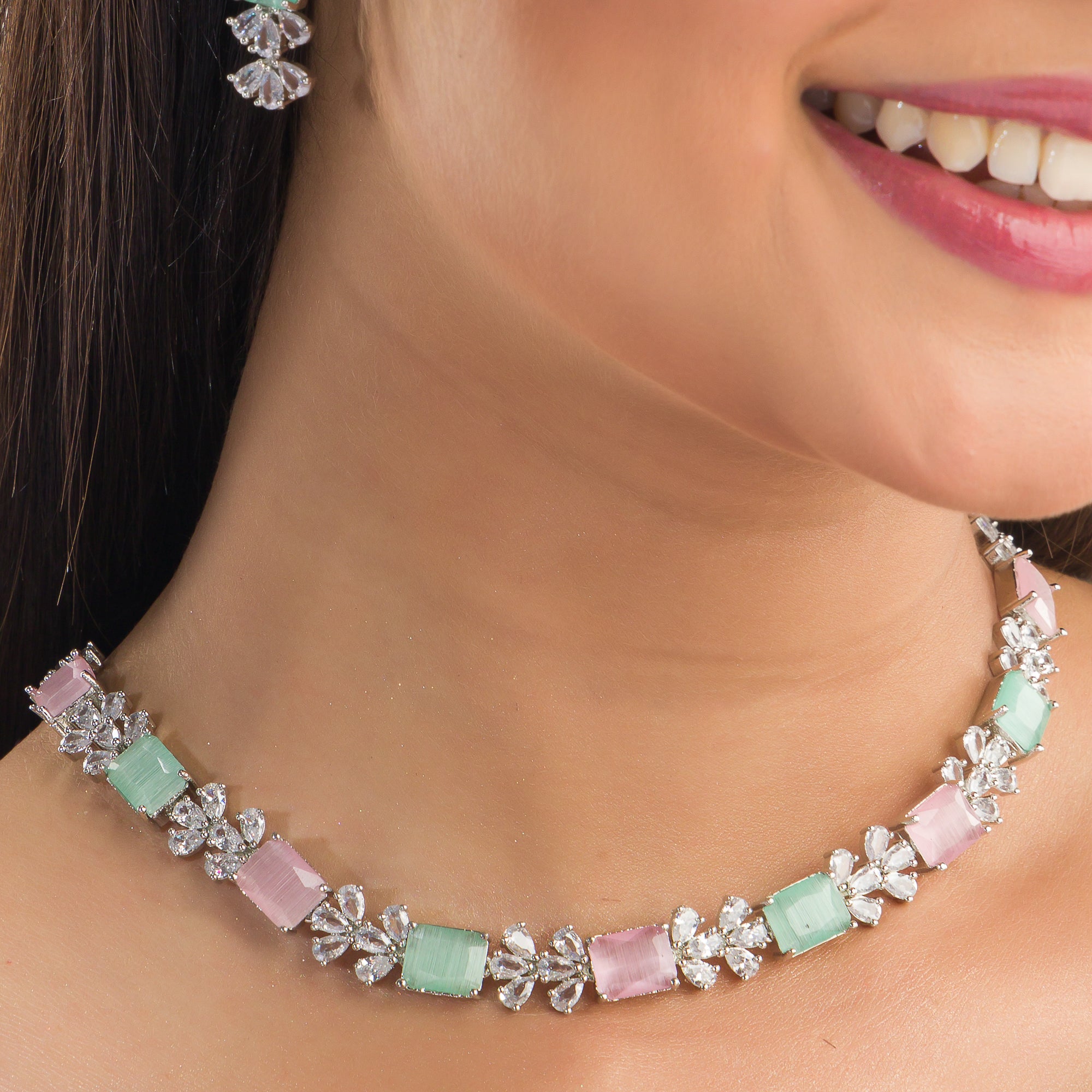 "Trendy pink and green zircon necklace in square design offers chic, modern elegance."