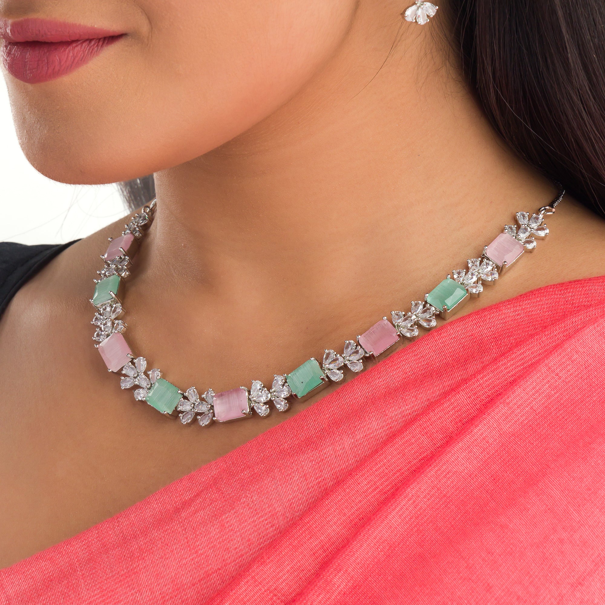 "Trendy pink and green zircon necklace in square design offers chic, modern elegance."