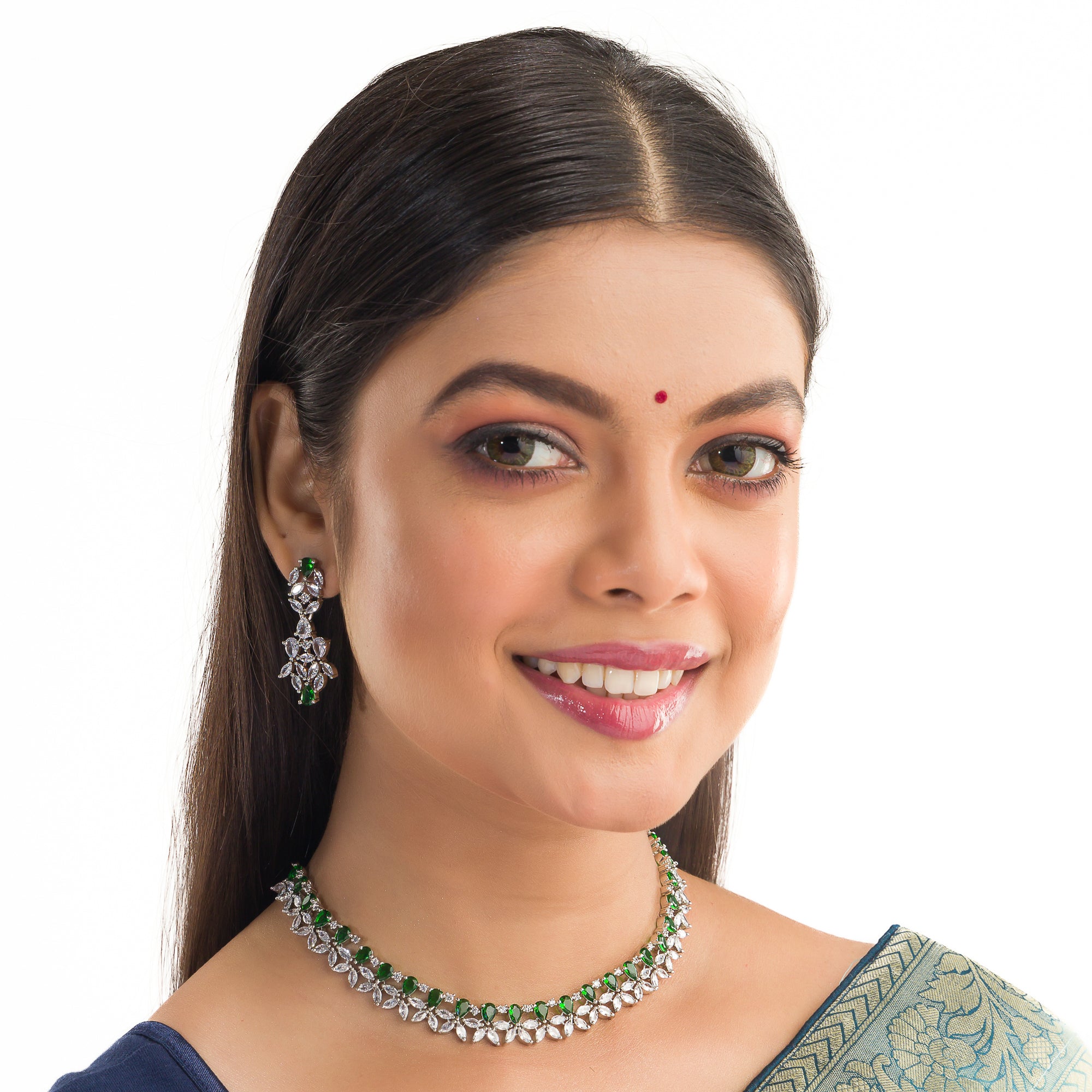 "Green and white zircon necklace in floral design adds vibrant, floral elegance."