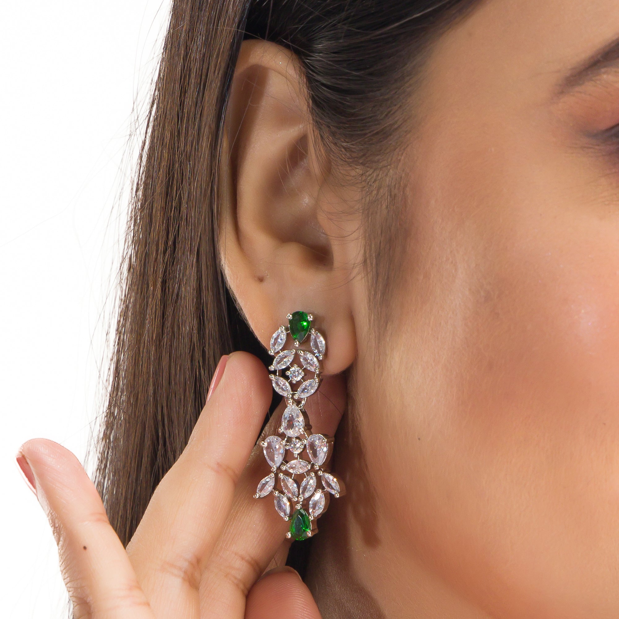 "Green and white zircon necklace in floral design adds vibrant, floral elegance."