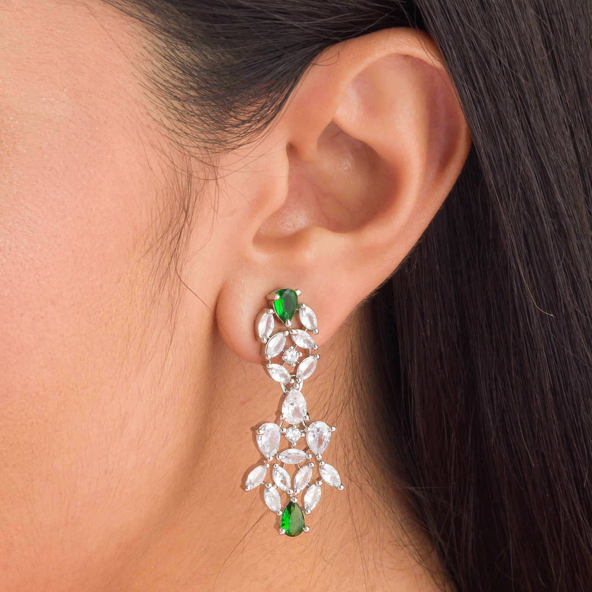 "Green and white zircon necklace in floral design adds vibrant, floral elegance."