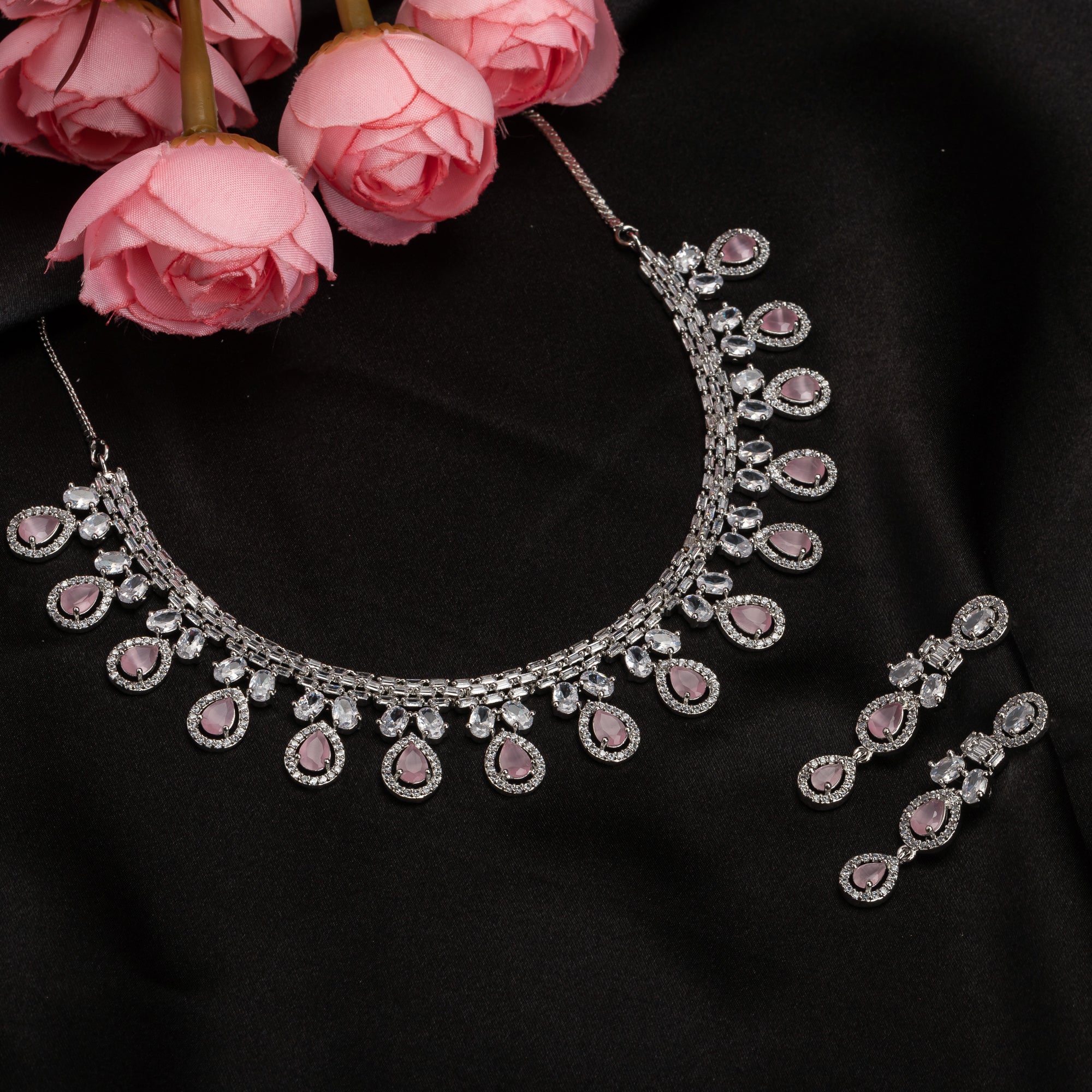 "Pink and white zircon necklace with silver polish creates a stunning, radiant look."