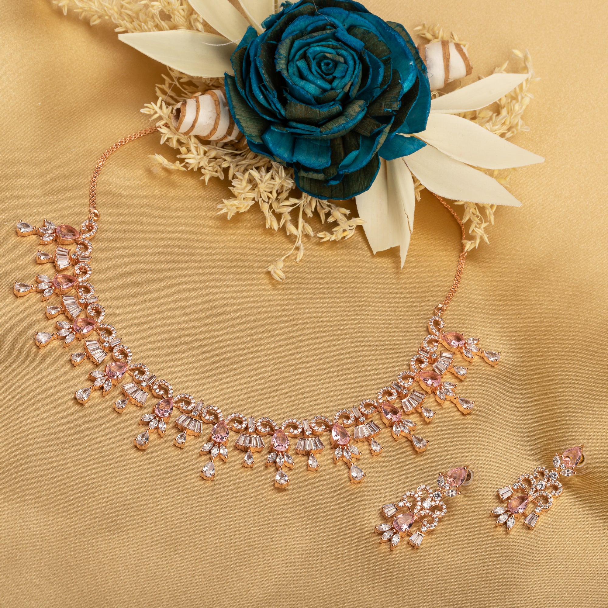 "Pink and white zircon necklace with rose gold polish offers a stunning, radiant look."