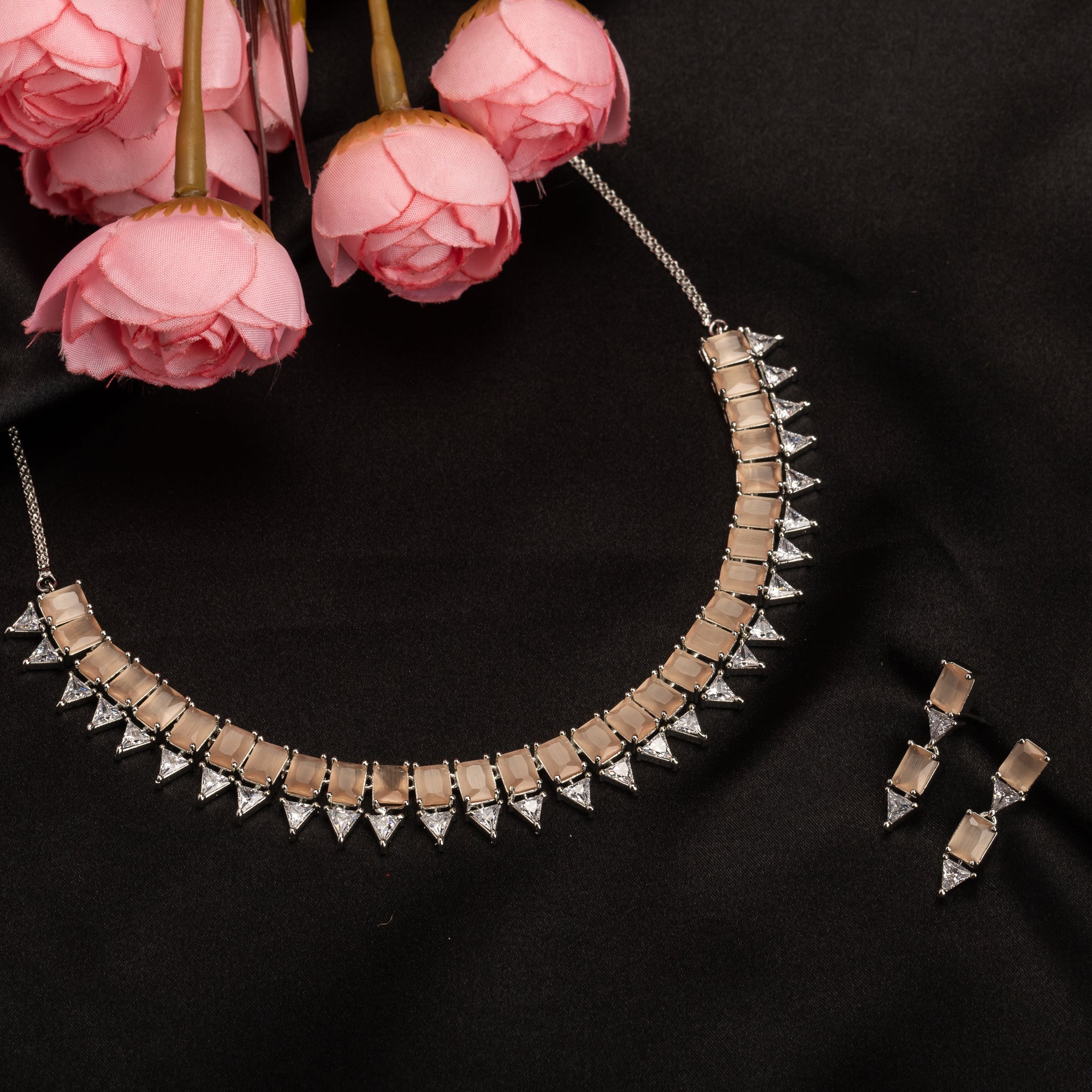 "Bronze and white zircon necklace exudes elegant contrast for a refined finish."