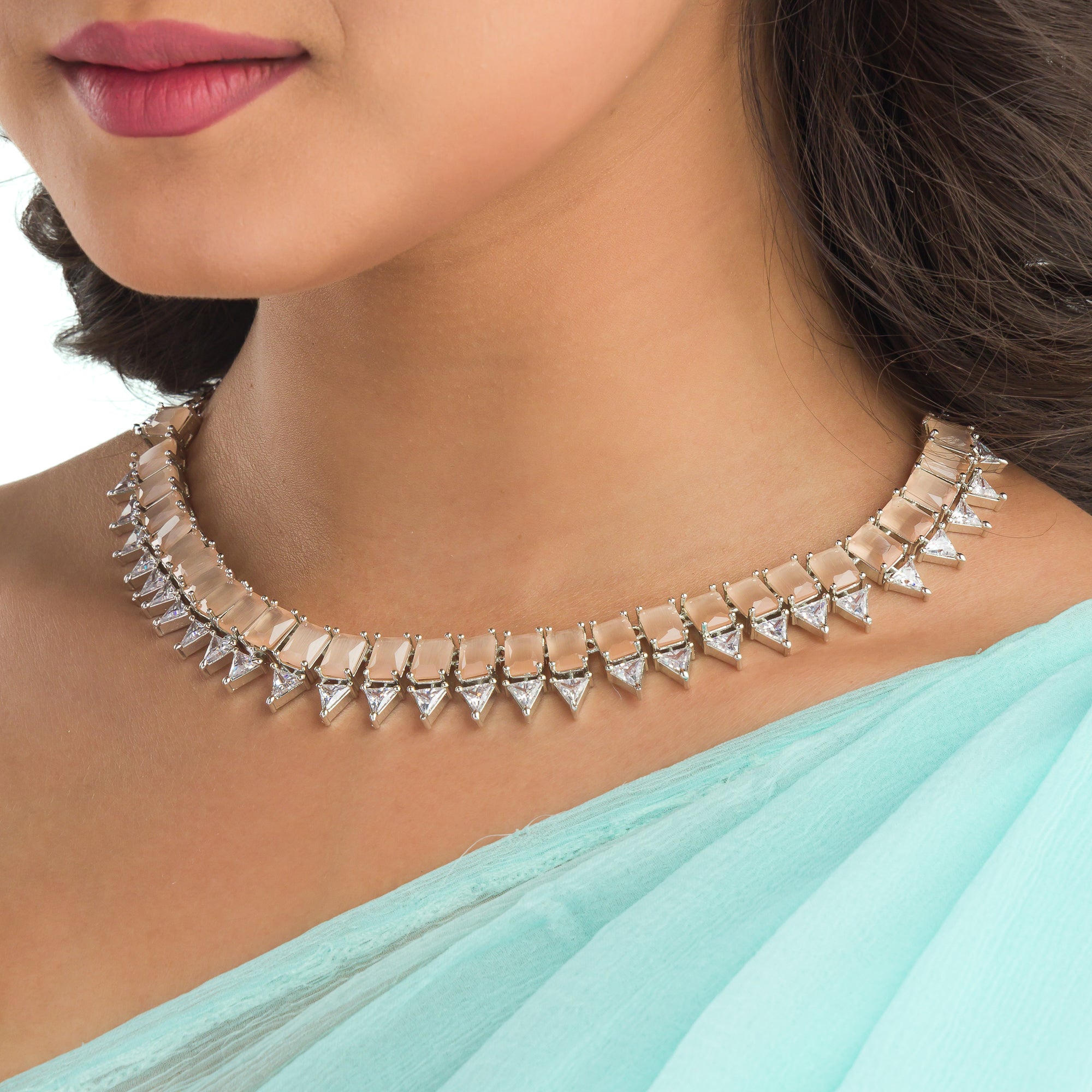 "Bronze and white zircon necklace exudes elegant contrast for a refined finish."