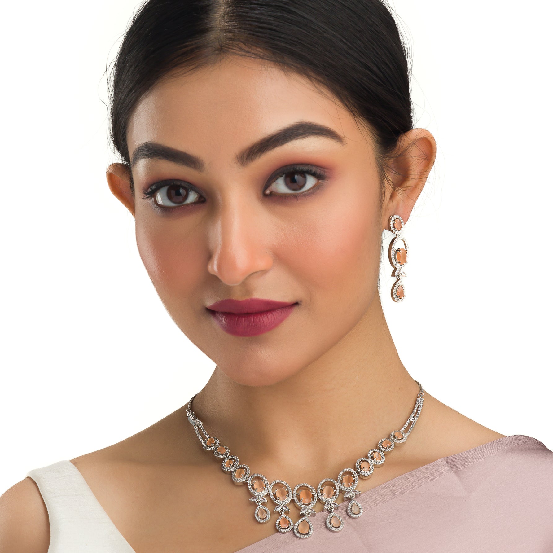 Salmon zircon necklace dazzles with its warm, unique glow for a stylish statement."